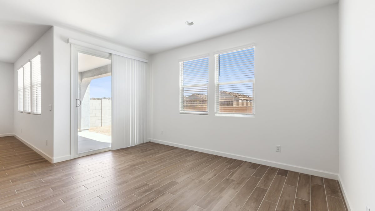 The Garland floor plan is a spacious single-story new home situated in the Agave neighborhood at Saguaro Bloom, offering 2,273 square feet of well-planned living space that perfectly suits a variety of lifestyles. This home features four bedrooms and three full bathrooms making it an ideal choice for families and those needing room to grow. As you step into the front porch and through the front door, you're greeted by the open concept layout with a seamless flow between the living, dining, and kitchen area, ensuring that every part of the home feels connected. The kitchen, equipped with a central island, quartz countertops, and your choice of flat panel Shaker-style cabinet doors with multiple color options available. A walk-in pantry provides additional storage, making it easy to keep everything organized.  The Garland's four bedrooms are thoughtfully arranged to provide both privacy and convenience. The primary suite is tucked away at the rear of the home, offering a private retreat with walk-in closets off the en-suite bathroom complete with an optional dual sink vanity. The additional bedrooms are strategically placed near the front and center of the home, each with access to a full bathroom, ensuring comfort for all family members or guests.  The large great room serves as the central gathering space, perfect for family activities or entertaining guests. Adjacent to the great room is a covered patio, extending your living space outdoors and offering a perfect spot to enjoy the serene surroundings of Saguaro Bloom.  Practical features like a dedicated utility room and a spacious three-car garage enhance the functionality of this home, while large windows ensure that natural light fills the space, creating a bright and inviting atmosphere.  Located within the vibrant Saguaro Bloom community, residents of The Garland can take advantage of a wide array of amenities, from resort-style pools to extensive walking trails. This home offers a unique opportunity to enjoy both comfort and community in one of Marana’s most sought-after neighborhoods.