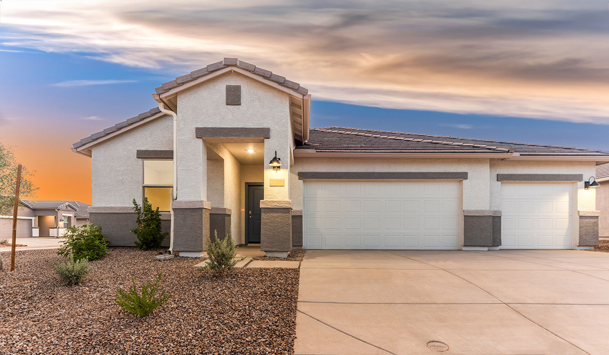 The Garland is a spacious single-story new home situated in the Agave neighborhood at Saguaro Bloom, offering 2,273 square feet of well-planned living. This home features four bedrooms and three full bathrooms making it an ideal choice for families and those needing room to grow.  As you enter through the porch and into the front door, you're greeted by the open concept layout with a seamless flow between the living, dining, and kitchen area. The kitchen features a large central island, quartz countertops, and your choice of flat panel Shaker-style cabinet doors with multiple color options available. A walk-in pantry provides additional storage, making it easy to keep everything organized.  The Garland's four bedrooms are thoughtfully arranged to provide both privacy and convenience. The primary suite is tucked away at the rear of the home, offering a private retreat with walk-in closets off the en-suite bathroom complete with an optional dual sink vanity. The additional bedrooms are strategically placed near the front and center of the home, each with access to a full bathroom, ensuring comfort for all family members or guests.  The large great room serves as the central gathering space, perfect for family activities or entertaining guests. Adjacent to the great room is a covered patio, extending your living space outdoors and offering a perfect spot to enjoy the serene surroundings of Saguaro Bloom.  Practical features like a dedicated utility room and a spacious three-car garage enhance the functionality of this home, while large windows ensure that natural light fills the space, creating a bright and inviting atmosphere.  Located within the vibrant Saguaro Bloom community, residents of The Garland can take advantage of a wide array of amenities, from resort-style pools to extensive walking trails. This home offers a unique opportunity to enjoy both comfort and community in one of Marana’s most sought-after neighborhoods.  *Images shown are for reference only. They depict The Garland spec home and may not represent the actual home.