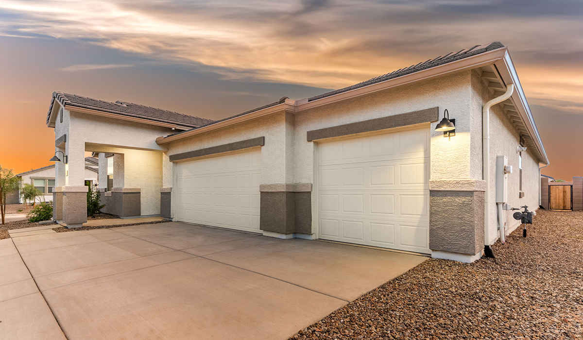 The Garland is a spacious single-story new home situated in the Agave neighborhood at Saguaro Bloom, offering 2,273 square feet of well-planned living. This home features four bedrooms and three full bathrooms making it an ideal choice for families and those needing room to grow.  As you enter through the porch and into the front door, you're greeted by the open concept layout with a seamless flow between the living, dining, and kitchen area. The kitchen features a large central island, quartz countertops, and your choice of flat panel Shaker-style cabinet doors with multiple color options available. A walk-in pantry provides additional storage, making it easy to keep everything organized.  The Garland's four bedrooms are thoughtfully arranged to provide both privacy and convenience. The primary suite is tucked away at the rear of the home, offering a private retreat with walk-in closets off the en-suite bathroom complete with an optional dual sink vanity. The additional bedrooms are strategically placed near the front and center of the home, each with access to a full bathroom, ensuring comfort for all family members or guests.  The large great room serves as the central gathering space, perfect for family activities or entertaining guests. Adjacent to the great room is a covered patio, extending your living space outdoors and offering a perfect spot to enjoy the serene surroundings of Saguaro Bloom.  Practical features like a dedicated utility room and a spacious three-car garage enhance the functionality of this home, while large windows ensure that natural light fills the space, creating a bright and inviting atmosphere.  Located within the vibrant Saguaro Bloom community, residents of The Garland can take advantage of a wide array of amenities, from resort-style pools to extensive walking trails. This home offers a unique opportunity to enjoy both comfort and community in one of Marana’s most sought-after neighborhoods.  *Images shown are for reference only. They depict The Garland spec home and may not represent the actual home.