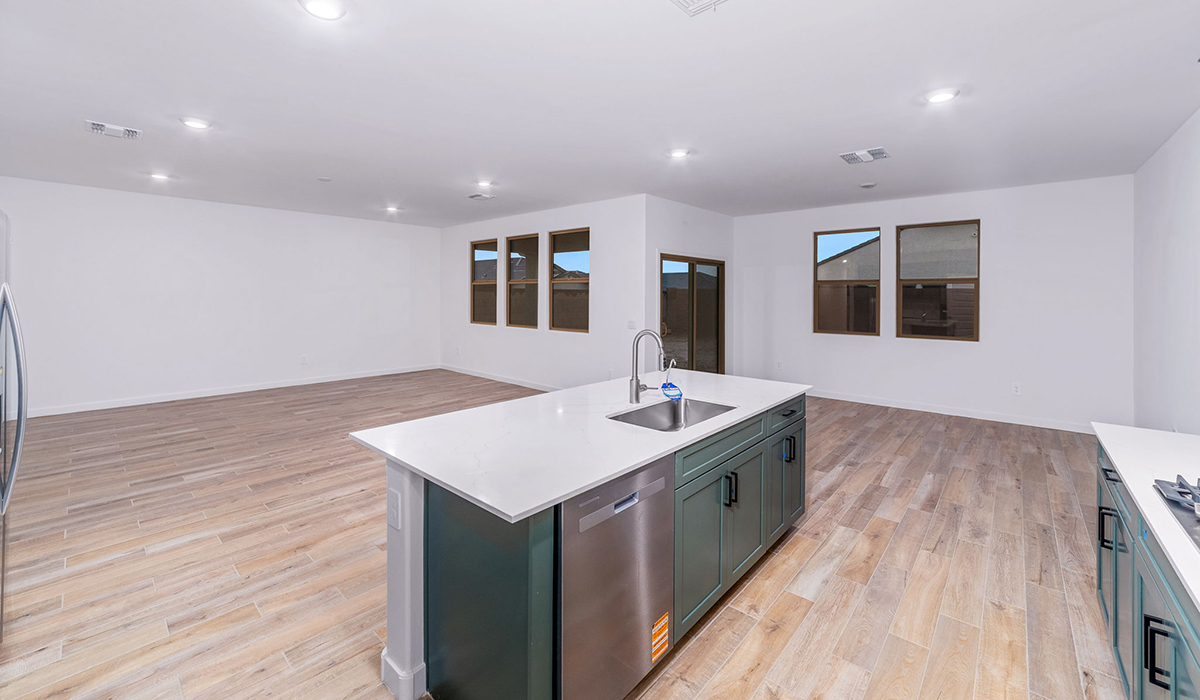 The Garland is a spacious single-story new home situated in the Agave neighborhood at Saguaro Bloom, offering 2,273 square feet of well-planned living. This home features four bedrooms and three full bathrooms making it an ideal choice for families and those needing room to grow.  As you enter through the porch and into the front door, you're greeted by the open concept layout with a seamless flow between the living, dining, and kitchen area. The kitchen features a large central island, quartz countertops, and your choice of flat panel Shaker-style cabinet doors with multiple color options available. A walk-in pantry provides additional storage, making it easy to keep everything organized.  The Garland's four bedrooms are thoughtfully arranged to provide both privacy and convenience. The primary suite is tucked away at the rear of the home, offering a private retreat with walk-in closets off the en-suite bathroom complete with an optional dual sink vanity. The additional bedrooms are strategically placed near the front and center of the home, each with access to a full bathroom, ensuring comfort for all family members or guests.  The large great room serves as the central gathering space, perfect for family activities or entertaining guests. Adjacent to the great room is a covered patio, extending your living space outdoors and offering a perfect spot to enjoy the serene surroundings of Saguaro Bloom.  Practical features like a dedicated utility room and a spacious three-car garage enhance the functionality of this home, while large windows ensure that natural light fills the space, creating a bright and inviting atmosphere.  Located within the vibrant Saguaro Bloom community, residents of The Garland can take advantage of a wide array of amenities, from resort-style pools to extensive walking trails. This home offers a unique opportunity to enjoy both comfort and community in one of Marana’s most sought-after neighborhoods.  *Images shown are for reference only. They depict the Garland floor plan and may not represent the actual home.