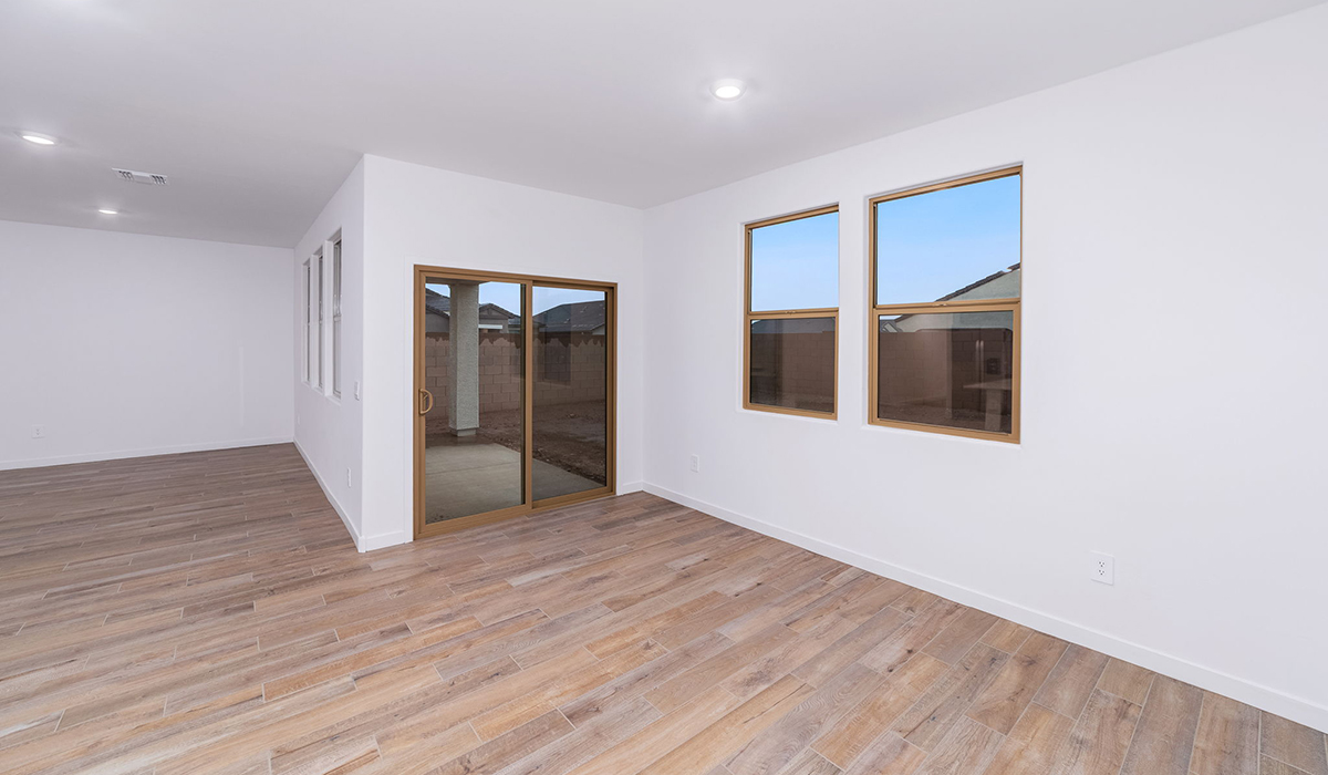 The Garland is a spacious single-story new home situated in the Agave neighborhood at Saguaro Bloom, offering 2,273 square feet of well-planned living. This home features four bedrooms and three full bathrooms making it an ideal choice for families and those needing room to grow.  As you enter through the porch and into the front door, you're greeted by the open concept layout with a seamless flow between the living, dining, and kitchen area. The kitchen features a large central island, quartz countertops, and your choice of flat panel Shaker-style cabinet doors with multiple color options available. A walk-in pantry provides additional storage, making it easy to keep everything organized.  The Garland's four bedrooms are thoughtfully arranged to provide both privacy and convenience. The primary suite is tucked away at the rear of the home, offering a private retreat with walk-in closets off the en-suite bathroom complete with an optional dual sink vanity. The additional bedrooms are strategically placed near the front and center of the home, each with access to a full bathroom, ensuring comfort for all family members or guests.  The large great room serves as the central gathering space, perfect for family activities or entertaining guests. Adjacent to the great room is a covered patio, extending your living space outdoors and offering a perfect spot to enjoy the serene surroundings of Saguaro Bloom.  Practical features like a dedicated utility room and a spacious three-car garage enhance the functionality of this home, while large windows ensure that natural light fills the space, creating a bright and inviting atmosphere.  Located within the vibrant Saguaro Bloom community, residents of The Garland can take advantage of a wide array of amenities, from resort-style pools to extensive walking trails. This home offers a unique opportunity to enjoy both comfort and community in one of Marana’s most sought-after neighborhoods.  *Images shown are for reference only. They depict the Garland floor plan and may not represent the actual home.