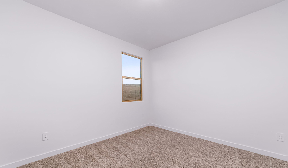 The Garland is a spacious single-story new home situated in the Agave neighborhood at Saguaro Bloom, offering 2,273 square feet of well-planned living. This home features four bedrooms and three full bathrooms making it an ideal choice for families and those needing room to grow.  As you enter through the porch and into the front door, you're greeted by the open concept layout with a seamless flow between the living, dining, and kitchen area. The kitchen features a large central island, quartz countertops, and your choice of flat panel Shaker-style cabinet doors with multiple color options available. A walk-in pantry provides additional storage, making it easy to keep everything organized.  The Garland's four bedrooms are thoughtfully arranged to provide both privacy and convenience. The primary suite is tucked away at the rear of the home, offering a private retreat with walk-in closets off the en-suite bathroom complete with an optional dual sink vanity. The additional bedrooms are strategically placed near the front and center of the home, each with access to a full bathroom, ensuring comfort for all family members or guests.  The large great room serves as the central gathering space, perfect for family activities or entertaining guests. Adjacent to the great room is a covered patio, extending your living space outdoors and offering a perfect spot to enjoy the serene surroundings of Saguaro Bloom.  Practical features like a dedicated utility room and a spacious three-car garage enhance the functionality of this home, while large windows ensure that natural light fills the space, creating a bright and inviting atmosphere.  Located within the vibrant Saguaro Bloom community, residents of The Garland can take advantage of a wide array of amenities, from resort-style pools to extensive walking trails. This home offers a unique opportunity to enjoy both comfort and community in one of Marana’s most sought-after neighborhoods.  *Images shown are for reference only. They depict the Garland floor plan and may not represent the actual home.