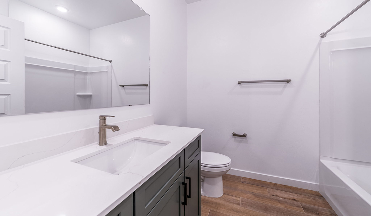 The Garland is a spacious single-story new home situated in the Agave neighborhood at Saguaro Bloom, offering 2,273 square feet of well-planned living. This home features four bedrooms and three full bathrooms making it an ideal choice for families and those needing room to grow.  As you enter through the porch and into the front door, you're greeted by the open concept layout with a seamless flow between the living, dining, and kitchen area. The kitchen features a large central island, quartz countertops, and your choice of flat panel Shaker-style cabinet doors with multiple color options available. A walk-in pantry provides additional storage, making it easy to keep everything organized.  The Garland's four bedrooms are thoughtfully arranged to provide both privacy and convenience. The primary suite is tucked away at the rear of the home, offering a private retreat with walk-in closets off the en-suite bathroom complete with an optional dual sink vanity. The additional bedrooms are strategically placed near the front and center of the home, each with access to a full bathroom, ensuring comfort for all family members or guests.  The large great room serves as the central gathering space, perfect for family activities or entertaining guests. Adjacent to the great room is a covered patio, extending your living space outdoors and offering a perfect spot to enjoy the serene surroundings of Saguaro Bloom.  Practical features like a dedicated utility room and a spacious three-car garage enhance the functionality of this home, while large windows ensure that natural light fills the space, creating a bright and inviting atmosphere.  Located within the vibrant Saguaro Bloom community, residents of The Garland can take advantage of a wide array of amenities, from resort-style pools to extensive walking trails. This home offers a unique opportunity to enjoy both comfort and community in one of Marana’s most sought-after neighborhoods.  *Images shown are for reference only. They depict the Garland floor plan and may not represent the actual home.