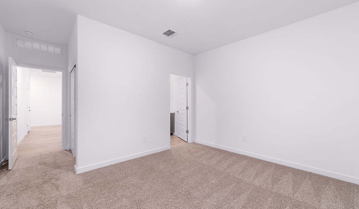 The Garland is a spacious single-story new home situated in the Agave neighborhood at Saguaro Bloom, offering 2,273 square feet of well-planned living. This home features four bedrooms and three full bathrooms making it an ideal choice for families and those needing room to grow.  As you enter through the porch and into the front door, you're greeted by the open concept layout with a seamless flow between the living, dining, and kitchen area. The kitchen features a large central island, quartz countertops, and your choice of flat panel Shaker-style cabinet doors with multiple color options available. A walk-in pantry provides additional storage, making it easy to keep everything organized.  The Garland's four bedrooms are thoughtfully arranged to provide both privacy and convenience. The primary suite is tucked away at the rear of the home, offering a private retreat with walk-in closets off the en-suite bathroom complete with an optional dual sink vanity. The additional bedrooms are strategically placed near the front and center of the home, each with access to a full bathroom, ensuring comfort for all family members or guests.  The large great room serves as the central gathering space, perfect for family activities or entertaining guests. Adjacent to the great room is a covered patio, extending your living space outdoors and offering a perfect spot to enjoy the serene surroundings of Saguaro Bloom.  Practical features like a dedicated utility room and a spacious three-car garage enhance the functionality of this home, while large windows ensure that natural light fills the space, creating a bright and inviting atmosphere.  Located within the vibrant Saguaro Bloom community, residents of The Garland can take advantage of a wide array of amenities, from resort-style pools to extensive walking trails. This home offers a unique opportunity to enjoy both comfort and community in one of Marana’s most sought-after neighborhoods.  *Images shown are for reference only. They depict the Garland floor plan and may not represent the actual home.