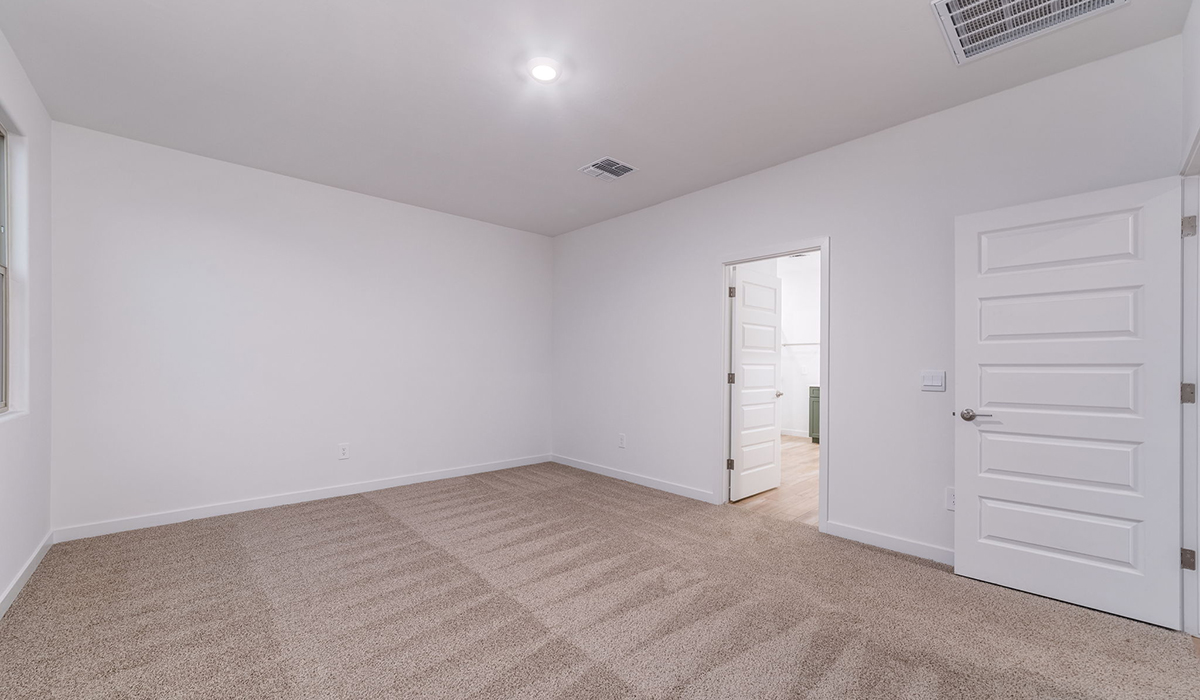 The Garland is a spacious single-story new home situated in the Agave neighborhood at Saguaro Bloom, offering 2,273 square feet of well-planned living. This home features four bedrooms and three full bathrooms making it an ideal choice for families and those needing room to grow.  As you enter through the porch and into the front door, you're greeted by the open concept layout with a seamless flow between the living, dining, and kitchen area. The kitchen features a large central island, quartz countertops, and your choice of flat panel Shaker-style cabinet doors with multiple color options available. A walk-in pantry provides additional storage, making it easy to keep everything organized.  The Garland's four bedrooms are thoughtfully arranged to provide both privacy and convenience. The primary suite is tucked away at the rear of the home, offering a private retreat with walk-in closets off the en-suite bathroom complete with an optional dual sink vanity. The additional bedrooms are strategically placed near the front and center of the home, each with access to a full bathroom, ensuring comfort for all family members or guests.  The large great room serves as the central gathering space, perfect for family activities or entertaining guests. Adjacent to the great room is a covered patio, extending your living space outdoors and offering a perfect spot to enjoy the serene surroundings of Saguaro Bloom.  Practical features like a dedicated utility room and a spacious three-car garage enhance the functionality of this home, while large windows ensure that natural light fills the space, creating a bright and inviting atmosphere.  Located within the vibrant Saguaro Bloom community, residents of The Garland can take advantage of a wide array of amenities, from resort-style pools to extensive walking trails. This home offers a unique opportunity to enjoy both comfort and community in one of Marana’s most sought-after neighborhoods.  *Images shown are for reference only. They depict the Garland floor plan and may not represent the actual home.