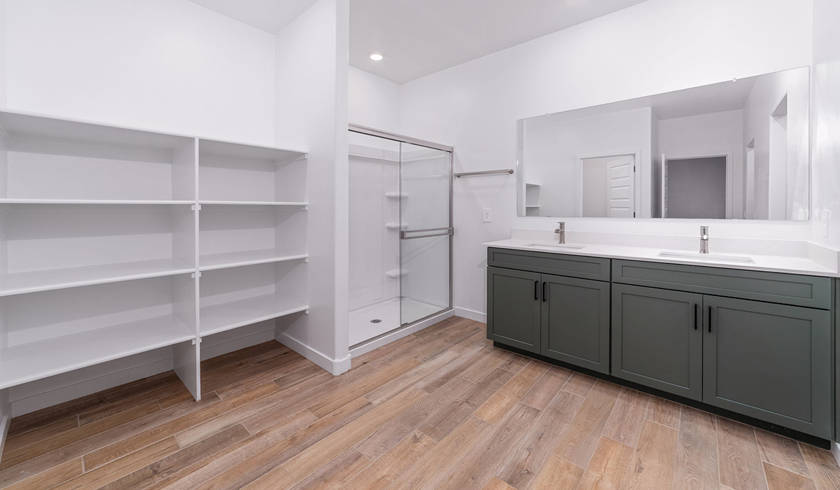 The Garland is a spacious single-story new home situated in the Agave neighborhood at Saguaro Bloom, offering 2,273 square feet of well-planned living. This home features four bedrooms and three full bathrooms making it an ideal choice for families and those needing room to grow.  As you enter through the porch and into the front door, you're greeted by the open concept layout with a seamless flow between the living, dining, and kitchen area. The kitchen features a large central island, quartz countertops, and your choice of flat panel Shaker-style cabinet doors with multiple color options available. A walk-in pantry provides additional storage, making it easy to keep everything organized.  The Garland's four bedrooms are thoughtfully arranged to provide both privacy and convenience. The primary suite is tucked away at the rear of the home, offering a private retreat with walk-in closets off the en-suite bathroom complete with an optional dual sink vanity. The additional bedrooms are strategically placed near the front and center of the home, each with access to a full bathroom, ensuring comfort for all family members or guests.  The large great room serves as the central gathering space, perfect for family activities or entertaining guests. Adjacent to the great room is a covered patio, extending your living space outdoors and offering a perfect spot to enjoy the serene surroundings of Saguaro Bloom.  Practical features like a dedicated utility room and a spacious three-car garage enhance the functionality of this home, while large windows ensure that natural light fills the space, creating a bright and inviting atmosphere.  Located within the vibrant Saguaro Bloom community, residents of The Garland can take advantage of a wide array of amenities, from resort-style pools to extensive walking trails. This home offers a unique opportunity to enjoy both comfort and community in one of Marana’s most sought-after neighborhoods.  *Images shown are for reference only. They depict the Garland floor plan and may not represent the actual home.