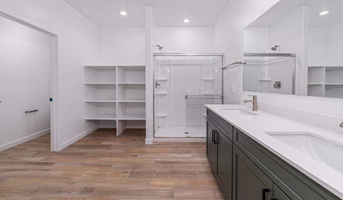 The Garland is a spacious single-story new home situated in the Agave neighborhood at Saguaro Bloom, offering 2,273 square feet of well-planned living. This home features four bedrooms and three full bathrooms making it an ideal choice for families and those needing room to grow.  As you enter through the porch and into the front door, you're greeted by the open concept layout with a seamless flow between the living, dining, and kitchen area. The kitchen features a large central island, quartz countertops, and your choice of flat panel Shaker-style cabinet doors with multiple color options available. A walk-in pantry provides additional storage, making it easy to keep everything organized.  The Garland's four bedrooms are thoughtfully arranged to provide both privacy and convenience. The primary suite is tucked away at the rear of the home, offering a private retreat with walk-in closets off the en-suite bathroom complete with an optional dual sink vanity. The additional bedrooms are strategically placed near the front and center of the home, each with access to a full bathroom, ensuring comfort for all family members or guests.  The large great room serves as the central gathering space, perfect for family activities or entertaining guests. Adjacent to the great room is a covered patio, extending your living space outdoors and offering a perfect spot to enjoy the serene surroundings of Saguaro Bloom.  Practical features like a dedicated utility room and a spacious three-car garage enhance the functionality of this home, while large windows ensure that natural light fills the space, creating a bright and inviting atmosphere.  Located within the vibrant Saguaro Bloom community, residents of The Garland can take advantage of a wide array of amenities, from resort-style pools to extensive walking trails. This home offers a unique opportunity to enjoy both comfort and community in one of Marana’s most sought-after neighborhoods.  *Images shown are for reference only. They depict the Garland floor plan and may not represent the actual home.