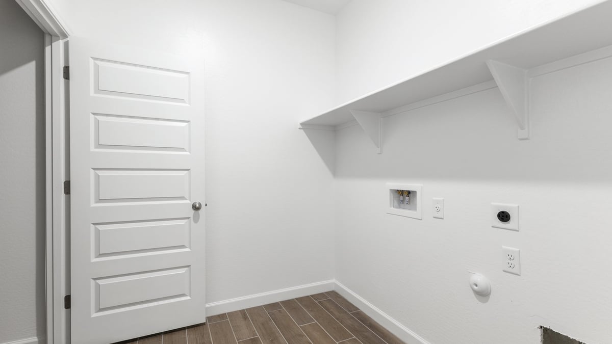 The Garland is a spacious single-story new home situated in the Agave neighborhood at Saguaro Bloom, offering 2,273 square feet of well-planned living. This home features four bedrooms and three full bathrooms making it an ideal choice for families and those needing room to grow.  As you enter through the porch and into the front door, you're greeted by the open concept layout with a seamless flow between the living, dining, and kitchen area. The kitchen features a large central island, quartz countertops, and your choice of flat panel Shaker-style cabinet doors with multiple color options available. A walk-in pantry provides additional storage, making it easy to keep everything organized.  The Garland's four bedrooms are thoughtfully arranged to provide both privacy and convenience. The primary suite is tucked away at the rear of the home, offering a private retreat with walk-in closets off the en-suite bathroom complete with an optional dual sink vanity. The additional bedrooms are strategically placed near the front and center of the home, each with access to a full bathroom, ensuring comfort for all family members or guests.  The large great room serves as the central gathering space, perfect for family activities or entertaining guests. Adjacent to the great room is a covered patio, extending your living space outdoors and offering a perfect spot to enjoy the serene surroundings of Saguaro Bloom.  Practical features like a dedicated utility room and a spacious three-car garage enhance the functionality of this home, while large windows ensure that natural light fills the space, creating a bright and inviting atmosphere.  Located within the vibrant Saguaro Bloom community, residents of The Garland can take advantage of a wide array of amenities, from resort-style pools to extensive walking trails. This home offers a unique opportunity to enjoy both comfort and community in one of Marana’s most sought-after neighborhoods.