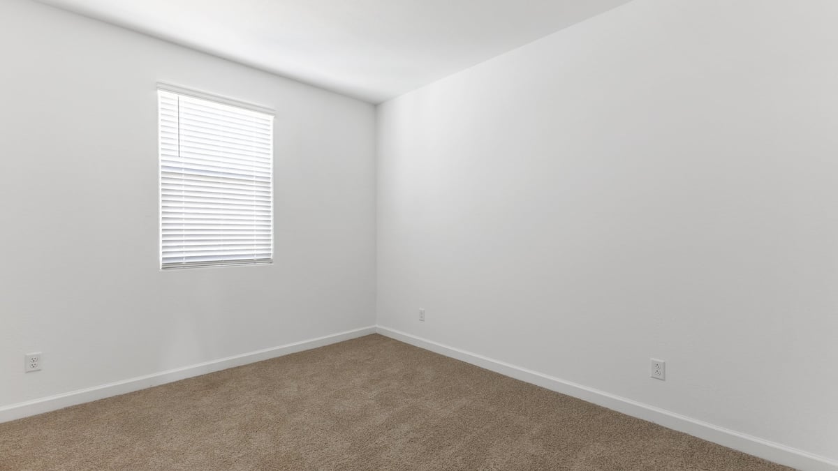 The Garland is a spacious single-story new home situated in the Agave neighborhood at Saguaro Bloom, offering 2,273 square feet of well-planned living. This home features four bedrooms and three full bathrooms making it an ideal choice for families and those needing room to grow.  As you enter through the porch and into the front door, you're greeted by the open concept layout with a seamless flow between the living, dining, and kitchen area. The kitchen features a large central island, quartz countertops, and your choice of flat panel Shaker-style cabinet doors with multiple color options available. A walk-in pantry provides additional storage, making it easy to keep everything organized.  The Garland's four bedrooms are thoughtfully arranged to provide both privacy and convenience. The primary suite is tucked away at the rear of the home, offering a private retreat with walk-in closets off the en-suite bathroom complete with an optional dual sink vanity. The additional bedrooms are strategically placed near the front and center of the home, each with access to a full bathroom, ensuring comfort for all family members or guests.  The large great room serves as the central gathering space, perfect for family activities or entertaining guests. Adjacent to the great room is a covered patio, extending your living space outdoors and offering a perfect spot to enjoy the serene surroundings of Saguaro Bloom.  Practical features like a dedicated utility room and a spacious three-car garage enhance the functionality of this home, while large windows ensure that natural light fills the space, creating a bright and inviting atmosphere.  Located within the vibrant Saguaro Bloom community, residents of The Garland can take advantage of a wide array of amenities, from resort-style pools to extensive walking trails. This home offers a unique opportunity to enjoy both comfort and community in one of Marana’s most sought-after neighborhoods.