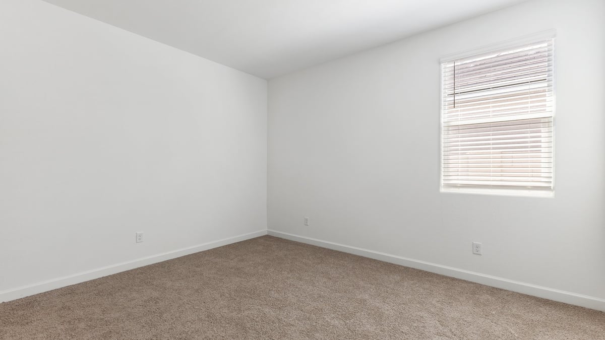 The Garland is a spacious single-story new home situated in the Agave neighborhood at Saguaro Bloom, offering 2,273 square feet of well-planned living. This home features four bedrooms and three full bathrooms making it an ideal choice for families and those needing room to grow.  As you enter through the porch and into the front door, you're greeted by the open concept layout with a seamless flow between the living, dining, and kitchen area. The kitchen features a large central island, quartz countertops, and your choice of flat panel Shaker-style cabinet doors with multiple color options available. A walk-in pantry provides additional storage, making it easy to keep everything organized.  The Garland's four bedrooms are thoughtfully arranged to provide both privacy and convenience. The primary suite is tucked away at the rear of the home, offering a private retreat with walk-in closets off the en-suite bathroom complete with an optional dual sink vanity. The additional bedrooms are strategically placed near the front and center of the home, each with access to a full bathroom, ensuring comfort for all family members or guests.  The large great room serves as the central gathering space, perfect for family activities or entertaining guests. Adjacent to the great room is a covered patio, extending your living space outdoors and offering a perfect spot to enjoy the serene surroundings of Saguaro Bloom.  Practical features like a dedicated utility room and a spacious three-car garage enhance the functionality of this home, while large windows ensure that natural light fills the space, creating a bright and inviting atmosphere.  Located within the vibrant Saguaro Bloom community, residents of The Garland can take advantage of a wide array of amenities, from resort-style pools to extensive walking trails. This home offers a unique opportunity to enjoy both comfort and community in one of Marana’s most sought-after neighborhoods.