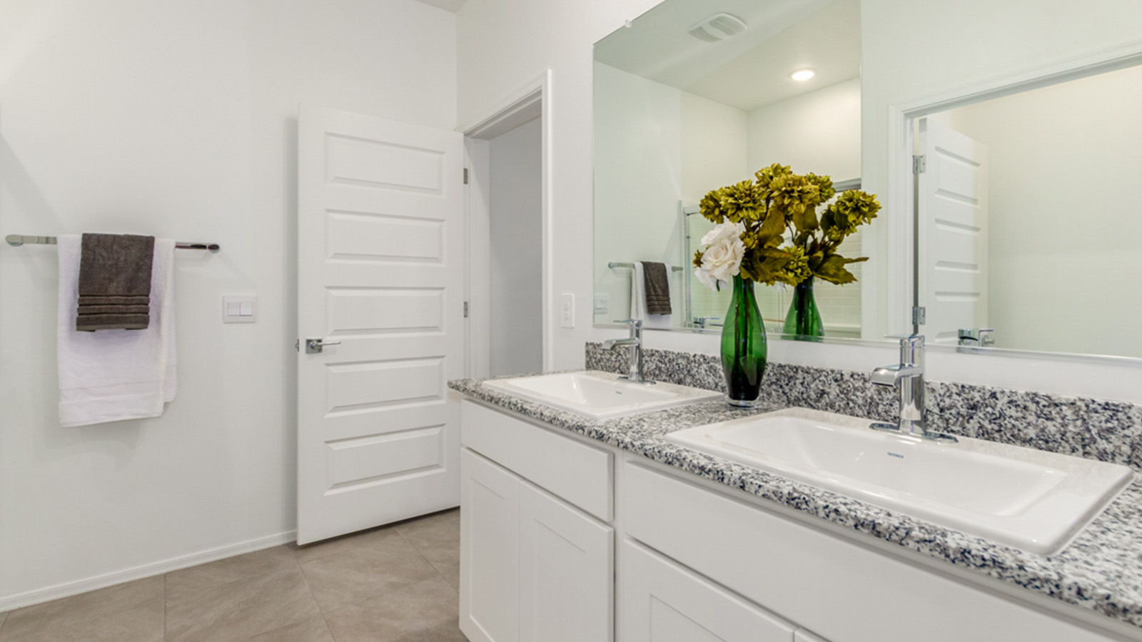 Welcome to The Amber, a thoughtfully designed single-story new home nestled in the Mesquite neighborhood at Saguaro Bloom, a master-planned community in Marana, Arizona. With 1,331 square feet of efficient living space, The Amber is perfect for those seeking a cozy yet functional home.  Step into a welcoming entryway that immediately introduces you to the home’s smart layout. The open design maximizes every square foot, with the heart of the home being the expansive great room, which flows seamlessly into the dining area and kitchen. The kitchen is well-equipped with a central island, granite countertops, and Shaker-style cabinets in either white or gray, offering a clean and modern aesthetic. A dedicated walk-in pantry adds extra storage, ensuring that all your culinary essentials are within reach.  The Amber offers three comfortable bedrooms, providing ample space for rest and relaxation. The primary suite is situated at the rear of the home, providing a sense of privacy. It includes a walk-in closet and an en-suite bathroom that features all the essentials for convenience. The two additional bedrooms are thoughtfully placed near the front of the home, sharing access to a full bathroom, making this layout perfect for families, guests, or a home office.  Practicality meets comfort in this home, with a utility room conveniently located near the kitchen and garage, providing easy access to the laundry area and additional storage. The Amber also includes a covered patio that extends the living space outdoors, ideal for enjoying Arizona’s beautiful weather.  The Amber is located in the vibrant Saguaro Bloom community, residents enjoy access to a wide range of amenities, from swimming pools and parks to miles of scenic walking trails. Whether you’re a first-time homebuyer or looking to downsize, The Amber offers a perfect blend of comfort, style, and convenience in one of Marana’s most desirable neighborhoods.