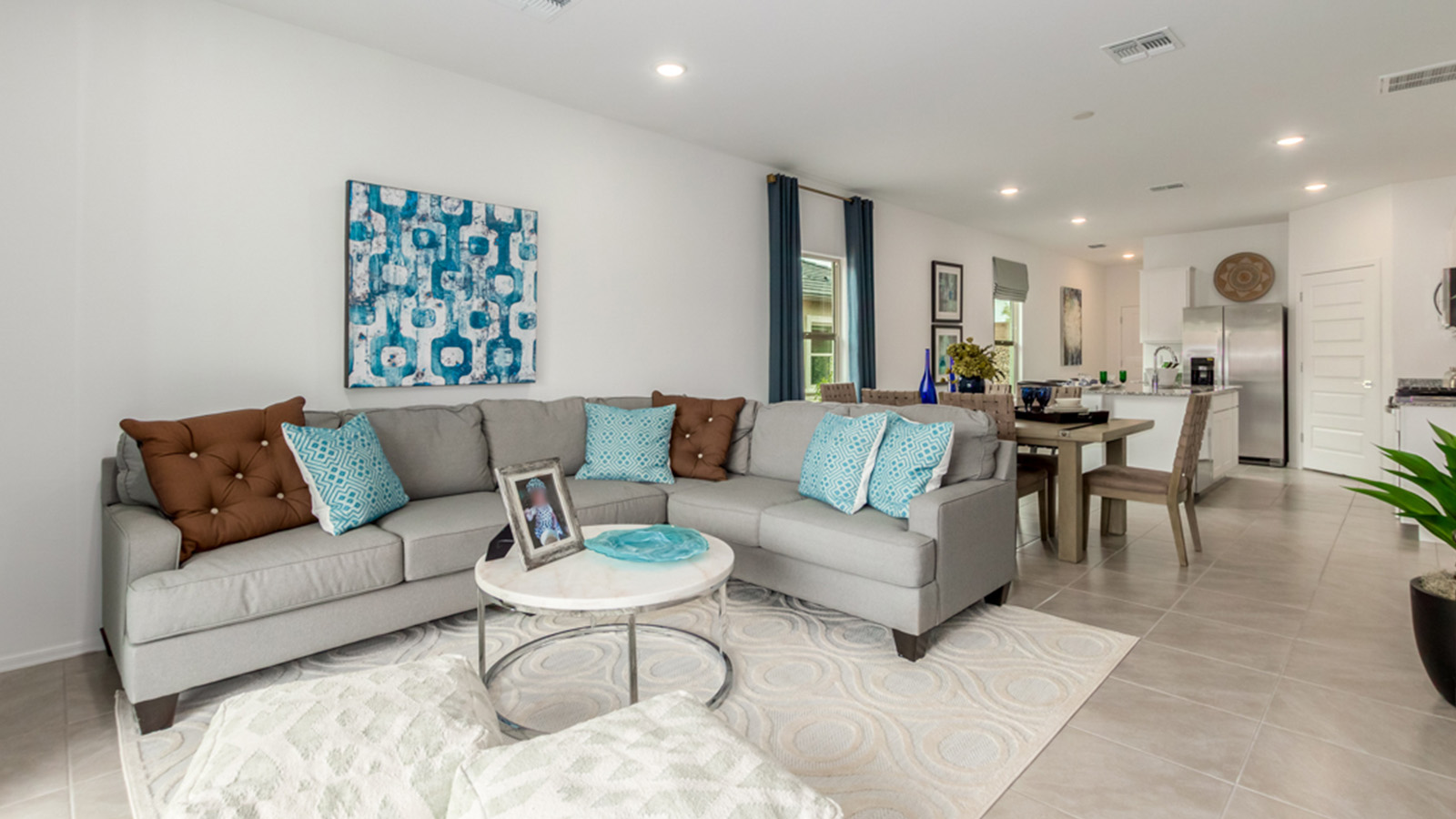 Welcome to The Amber, a thoughtfully designed single-story new home nestled in the Mesquite neighborhood at Saguaro Bloom, a master-planned community in Marana, Arizona. With 1,331 square feet of efficient living space, The Amber is perfect for those seeking a cozy yet functional home.  *Images shown are for reference only. They depict the Amber model home and may not represent the actual home. Step into a welcoming entryway that immediately introduces you to the home’s smart layout. The open design maximizes every square foot, with the heart of the home being the expansive great room, which flows seamlessly into the dining area and kitchen. The kitchen is well-equipped with a central island, granite countertops, and Shaker-style cabinets in either white or gray, offering a clean and modern aesthetic. A dedicated walk-in pantry adds extra storage, ensuring that all your culinary essentials are within reach.  The Amber offers three comfortable bedrooms, providing ample space for rest and relaxation. The primary suite is situated at the rear of the home, providing a sense of privacy. It includes a walk-in closet and an en-suite bathroom that features all the essentials for convenience. The two additional bedrooms are thoughtfully placed near the front of the home, sharing access to a full bathroom, making this layout perfect for families, guests, or a home office.  Practicality meets comfort in this home, with a utility room conveniently located near the kitchen and garage, providing easy access to the laundry area and additional storage. The Amber also includes a covered patio that extends the living space outdoors, ideal for enjoying Arizona’s beautiful weather.  The Amber is located in the vibrant Saguaro Bloom community, residents enjoy access to a wide range of amenities, from swimming pools and parks to miles of scenic walking trails. Whether you’re a first-time homebuyer or looking to downsize, The Amber offers a perfect blend of comfort, style, and convenience in one of Marana’s most desirable neighborhoods.