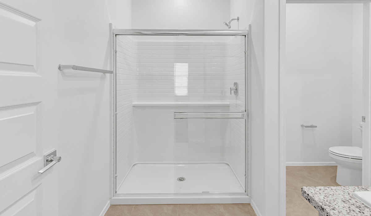 Welcome to The Amber, a thoughtfully designed single-story new home nestled in the Mesquite neighborhood at Saguaro Bloom, a master-planned community in Marana, Arizona. With 1,331 square feet of efficient living space, The Amber is perfect for those seeking a cozy yet functional home.  Step into a welcoming entryway that immediately introduces you to the home’s smart layout. The open design maximizes every square foot, with the heart of the home being the expansive great room, which flows seamlessly into the dining area and kitchen. The kitchen is well-equipped with a central island, granite countertops, and Shaker-style cabinets in either white or gray, offering a clean and modern aesthetic. A dedicated walk-in pantry adds extra storage, ensuring that all your culinary essentials are within reach.  The Amber offers three comfortable bedrooms, providing ample space for rest and relaxation. The primary suite is situated at the rear of the home, providing a sense of privacy. It includes a walk-in closet and an en-suite bathroom that features all the essentials for convenience. The two additional bedrooms are thoughtfully placed near the front of the home, sharing access to a full bathroom, making this layout perfect for families, guests, or a home office.  Practicality meets comfort in this home, with a utility room conveniently located near the kitchen and garage, providing easy access to the laundry area and additional storage. The Amber also includes a covered patio that extends the living space outdoors, ideal for enjoying Arizona’s beautiful weather.  The Amber is located in the vibrant Saguaro Bloom community, residents enjoy access to a wide range of amenities, from swimming pools and parks to miles of scenic walking trails. Whether you’re a first-time homebuyer or looking to downsize, The Amber offers a perfect blend of comfort, style, and convenience in one of Marana’s most desirable neighborhoods.  *Images shown are for reference only. They depict the Amber model home and may not represent the actual home.