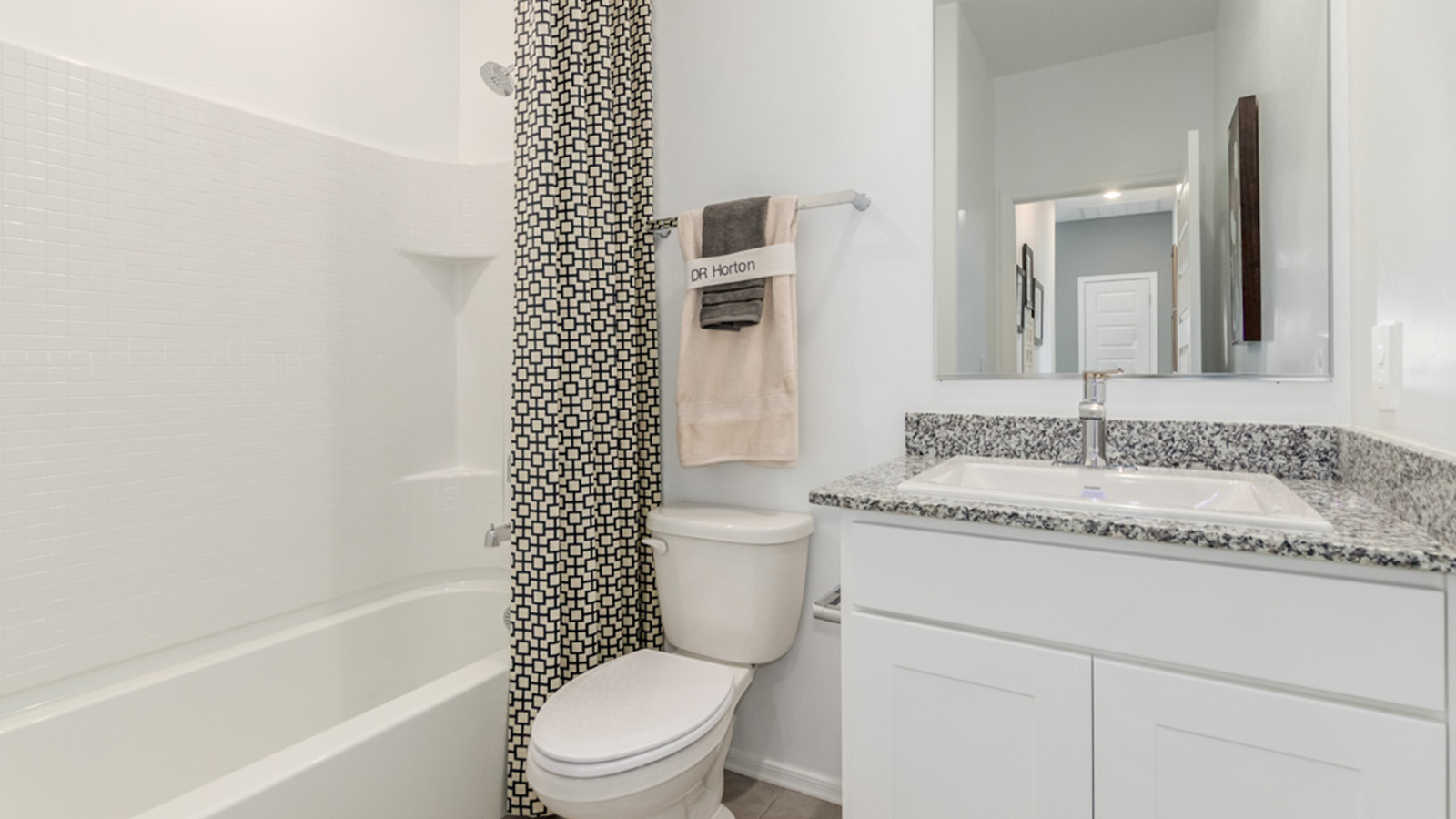 Welcome to The Amber, a thoughtfully designed single-story new home nestled in the Mesquite neighborhood at Saguaro Bloom, a master-planned community in Marana, Arizona. With 1,331 square feet of efficient living space, The Amber is perfect for those seeking a cozy yet functional home.  Step into a welcoming entryway that immediately introduces you to the home’s smart layout. The open design maximizes every square foot, with the heart of the home being the expansive great room, which flows seamlessly into the dining area and kitchen. The kitchen is well-equipped with a central island, granite countertops, and Shaker-style cabinets in either white or gray, offering a clean and modern aesthetic. A dedicated walk-in pantry adds extra storage, ensuring that all your culinary essentials are within reach.  The Amber offers three comfortable bedrooms, providing ample space for rest and relaxation. The primary suite is situated at the rear of the home, providing a sense of privacy. It includes a walk-in closet and an en-suite bathroom that features all the essentials for convenience. The two additional bedrooms are thoughtfully placed near the front of the home, sharing access to a full bathroom, making this layout perfect for families, guests, or a home office.  Practicality meets comfort in this home, with a utility room conveniently located near the kitchen and garage, providing easy access to the laundry area and additional storage. The Amber also includes a covered patio that extends the living space outdoors, ideal for enjoying Arizona’s beautiful weather.  The Amber is not just a home; it’s a lifestyle. Located in the vibrant Saguaro Bloom community, residents enjoy access to a wide range of amenities, from swimming pools and parks to miles of scenic walking trails. Whether you’re a first-time homebuyer or looking to downsize, The Amber offers a perfect blend of comfort, style, and convenience in one of Marana’s most desirable neighborhoods.