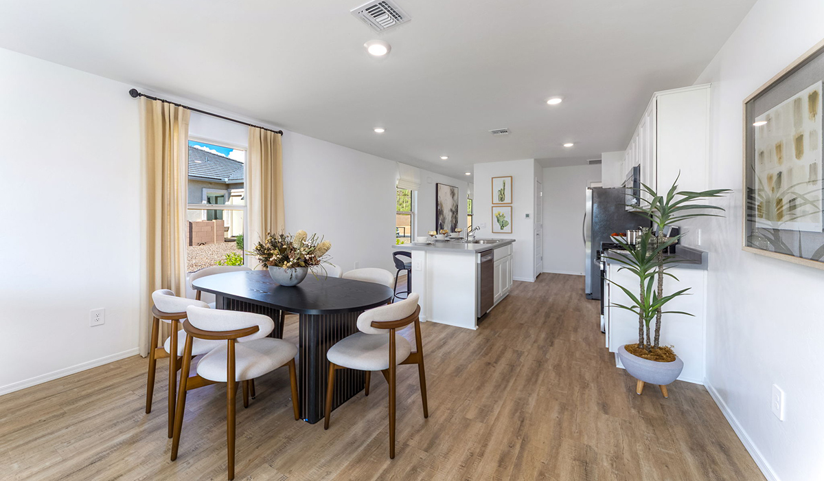 Welcome to The Caroline, the newest floor plan available at Saguaro Bloom by D.R. Horton in Marana, Arizona. This single-story new home is 1,536 square feet and is thoughtfully planned out throughout the living spaces. The Caroline offers three bedrooms and two bathrooms, making it ideal for families who value both space and convenience.  As you enter through the inviting covered porch, you’re greeted by a bright and airy entryway that flows into the heart of the home. The expansive great room, dining area, and kitchen are thoughtfully connected, creating an intimate space. The kitchen features a large island, laminate countertops, Shaker-style cabinetry, spacious pantry, and modern stainless-steel appliances ensure your kitchen is both functional and stylish.  The Caroline’s layout includes a generously sized primary bedroom, carefully positioned for privacy at the rear of the home. This room features a large walk-in closet and an en-suite bathroom. The additional two bedrooms are well-sized and located in separate areas of the home with easy access to the main full bathroom.  The covered patio, accessible from the great room, offers a perfect spot for outdoor living, where you can enjoy Arizona’s beautiful weather throughout the year. Designed with practicality in mind, this floorplan includes a two-car garage with an option for a third, a utility room with washer and dryer connections, and additional storage space.  The Caroline is designed with energy efficiency in mind. This DOE Zero Energy Ready Home offers a sustainable lifestyle with advanced features like tankless water heaters, energy-efficient LED lighting, and high-performance insulation, ensuring lower utility costs and a reduced environmental footprint.  Living in Saguaro Bloom provides residents with access to top-rated schools, community parks, scenic walking trails, and resort like amenities. This vibrant neighborhood is the perfect setting for those looking to enjoy the best of Arizona living.  *Images shown are for reference only. They depict The Caroline sales model home and may not represent the actual home.