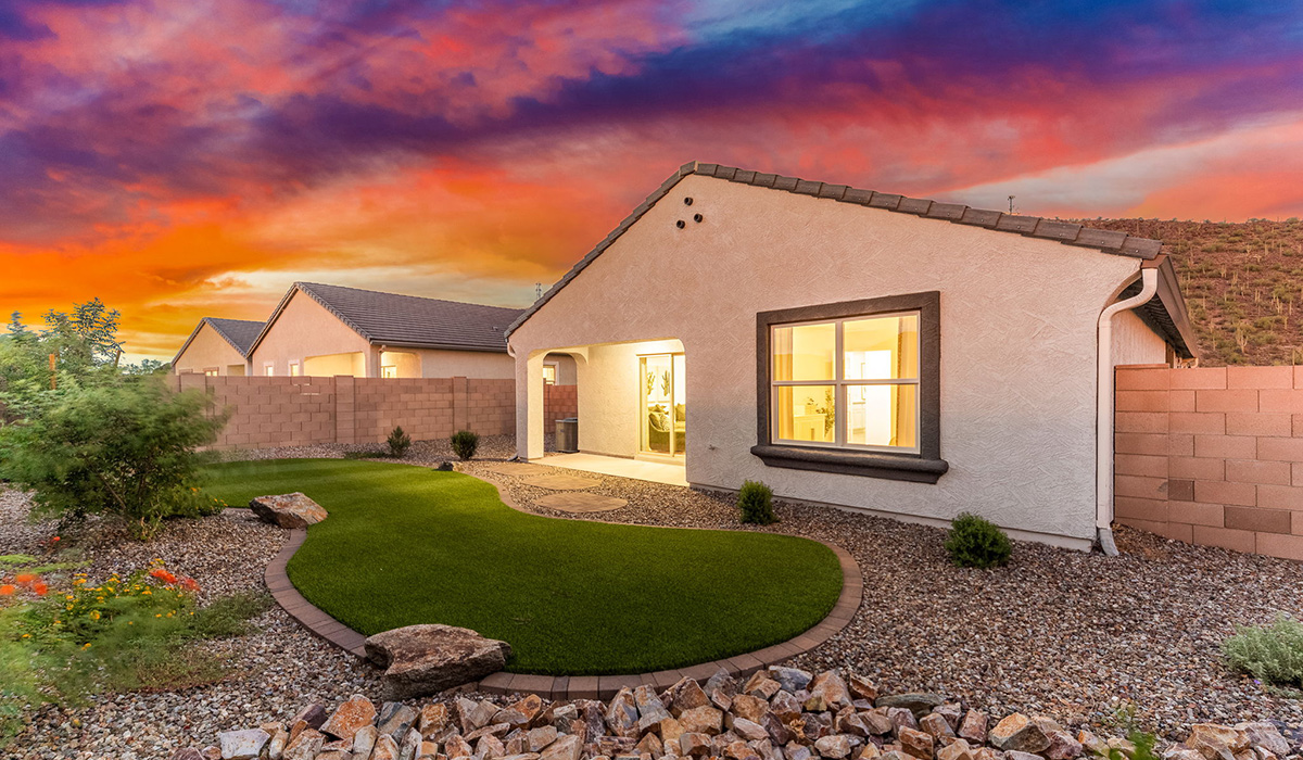 Welcome to The Caroline, the newest floor plan available at Saguaro Bloom by D.R. Horton in Marana, Arizona. This single-story new home is 1,536 square feet and is thoughtfully planned out throughout the living spaces. The Caroline offers three bedrooms and two bathrooms, making it ideal for families who value both space and convenience.  As you enter through the inviting covered porch, you’re greeted by a bright and airy entryway that flows into the heart of the home. The expansive great room, dining area, and kitchen are thoughtfully connected, creating an intimate space. The kitchen features a large island, laminate countertops, Shaker-style cabinetry, spacious pantry, and modern stainless-steel appliances ensure your kitchen is both functional and stylish.  The Caroline’s layout includes a generously sized primary bedroom, carefully positioned for privacy at the rear of the home. This room features a large walk-in closet and an en-suite bathroom. The additional two bedrooms are well-sized and located in separate areas of the home with easy access to the main full bathroom.  The covered patio, accessible from the great room, offers a perfect spot for outdoor living, where you can enjoy Arizona’s beautiful weather throughout the year. Designed with practicality in mind, this floorplan includes a two-car garage with an option for a third, a utility room with washer and dryer connections, and additional storage space.  The Caroline is designed with energy efficiency in mind. This DOE Zero Energy Ready Home offers a sustainable lifestyle with advanced features like tankless water heaters, energy-efficient LED lighting, and high-performance insulation, ensuring lower utility costs and a reduced environmental footprint.  Living in Saguaro Bloom provides residents with access to top-rated schools, community parks, scenic walking trails, and resort like amenities. This vibrant neighborhood is the perfect setting for those looking to enjoy the best of Arizona living.  *Images shown are for reference only. They depict The Caroline sales model home and may not represent the actual home.