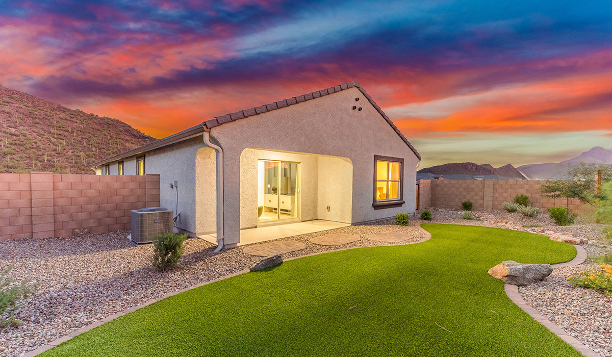 Welcome to The Caroline, the newest floor plan available at Saguaro Bloom by D.R. Horton in Marana, Arizona. This single-story new home is 1,536 square feet and is thoughtfully planned out throughout the living spaces. The Caroline offers three bedrooms and two bathrooms, making it ideal for families who value both space and convenience.  As you enter through the inviting covered porch, you’re greeted by a bright and airy entryway that flows into the heart of the home. The expansive great room, dining area, and kitchen are thoughtfully connected, creating an intimate space. The kitchen features a large island, laminate countertops, Shaker-style cabinetry, spacious pantry, and modern stainless-steel appliances ensure your kitchen is both functional and stylish.  The Caroline’s layout includes a generously sized primary bedroom, carefully positioned for privacy at the rear of the home. This room features a large walk-in closet and an en-suite bathroom. The additional two bedrooms are well-sized and located in separate areas of the home with easy access to the main full bathroom.  The covered patio, accessible from the great room, offers a perfect spot for outdoor living, where you can enjoy Arizona’s beautiful weather throughout the year. Designed with practicality in mind, this floorplan includes a two-car garage with an option for a third, a utility room with washer and dryer connections, and additional storage space.  The Caroline is designed with energy efficiency in mind. This DOE Zero Energy Ready Home offers a sustainable lifestyle with advanced features like tankless water heaters, energy-efficient LED lighting, and high-performance insulation, ensuring lower utility costs and a reduced environmental footprint.  Living in Saguaro Bloom provides residents with access to top-rated schools, community parks, scenic walking trails, and resort like amenities. This vibrant neighborhood is the perfect setting for those looking to enjoy the best of Arizona living.  *Images shown are for reference only. They depict The Caroline sales model home and may not represent the actual home.