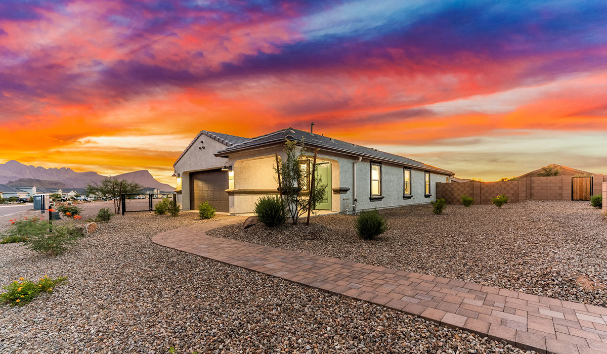 Welcome to The Caroline, the newest floor plan available at Saguaro Bloom by D.R. Horton in Marana, Arizona. This single-story new home is 1,536 square feet and is thoughtfully planned out throughout the living spaces. The Caroline offers three bedrooms and two bathrooms, making it ideal for families who value both space and convenience.  As you enter through the inviting covered porch, you’re greeted by a bright and airy entryway that flows into the heart of the home. The expansive great room, dining area, and kitchen are thoughtfully connected, creating an intimate space. The kitchen features a large island, laminate countertops, Shaker-style cabinetry, spacious pantry, and modern stainless-steel appliances ensure your kitchen is both functional and stylish.  The Caroline’s layout includes a generously sized primary bedroom, carefully positioned for privacy at the rear of the home. This room features a large walk-in closet and an en-suite bathroom. The additional two bedrooms are well-sized and located in separate areas of the home with easy access to the main full bathroom.  The covered patio, accessible from the great room, offers a perfect spot for outdoor living, where you can enjoy Arizona’s beautiful weather throughout the year. Designed with practicality in mind, this floorplan includes a two-car garage with an option for a third, a utility room with washer and dryer connections, and additional storage space.  The Caroline is designed with energy efficiency in mind. This DOE Zero Energy Ready Home offers a sustainable lifestyle with advanced features like tankless water heaters, energy-efficient LED lighting, and high-performance insulation, ensuring lower utility costs and a reduced environmental footprint.  Living in Saguaro Bloom provides residents with access to top-rated schools, community parks, scenic walking trails, and resort like amenities. This vibrant neighborhood is the perfect setting for those looking to enjoy the best of Arizona living.  *Images shown are for reference only. They depict the Caroline model home and may not represent the actual home.