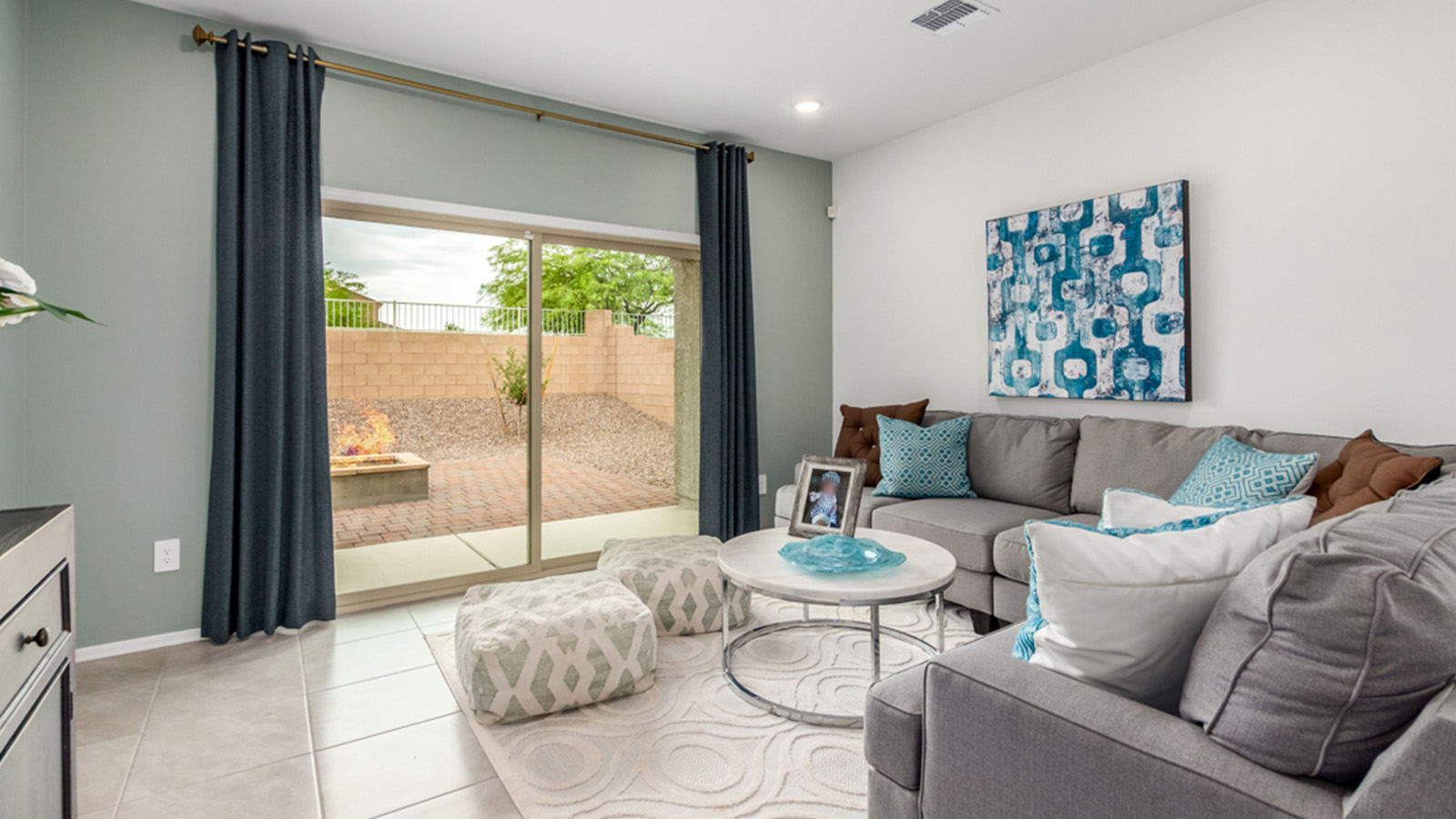 Welcome to The Amber, a thoughtfully designed single-story new home nestled in the Mesquite neighborhood at Saguaro Bloom, a master-planned community in Marana, Arizona. With 1,331 square feet of efficient living space, The Amber is perfect for those seeking a cozy yet functional home.  Step into a welcoming entryway that immediately introduces you to the home’s smart layout. The open design maximizes every square foot, with the heart of the home being the expansive great room, which flows seamlessly into the dining area and kitchen. The kitchen is well-equipped with a central island, granite countertops, and Shaker-style cabinets in either white or gray, offering a clean and modern aesthetic. A dedicated walk-in pantry adds extra storage, ensuring that all your culinary essentials are within reach.  The Amber offers three comfortable bedrooms, providing ample space for rest and relaxation. The primary suite is situated at the rear of the home, providing a sense of privacy. It includes a walk-in closet and an en-suite bathroom that features all the essentials for convenience. The two additional bedrooms are thoughtfully placed near the front of the home, sharing access to a full bathroom, making this layout perfect for families, guests, or a home office.  Practicality meets comfort in this home, with a utility room conveniently located near the kitchen and garage, providing easy access to the laundry area and additional storage. The Amber also includes a covered patio that extends the living space outdoors, ideal for enjoying Arizona’s beautiful weather.  The Amber is located in the vibrant Saguaro Bloom community, residents enjoy access to a wide range of amenities, from swimming pools and parks to miles of scenic walking trails. Whether you’re a first-time homebuyer or looking to downsize, The Amber offers a perfect blend of comfort, style, and convenience in one of Marana’s most desirable neighborhoods.  *Images shown are for reference only. They depict The Amber sales model home and may not represent the actual home.