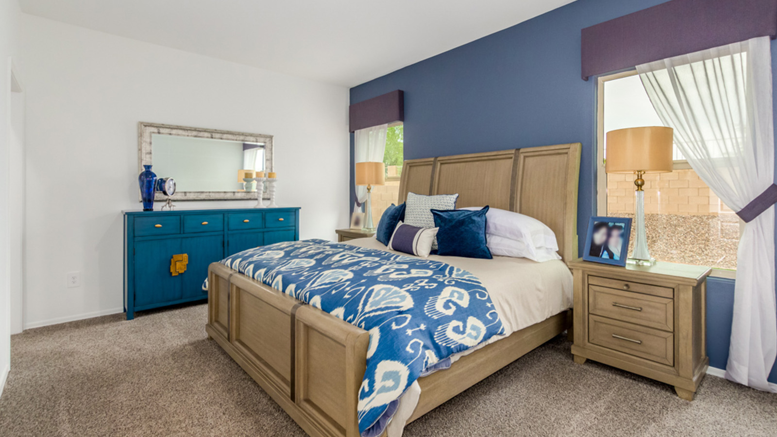 Welcome to The Amber, a thoughtfully designed single-story new home nestled in the Mesquite neighborhood at Saguaro Bloom, a master-planned community in Marana, Arizona. With 1,331 square feet of efficient living space, The Amber is perfect for those seeking a cozy yet functional home.  Step into a welcoming entryway that immediately introduces you to the home’s smart layout. The open design maximizes every square foot, with the heart of the home being the expansive great room, which flows seamlessly into the dining area and kitchen. The kitchen is well-equipped with a central island, granite countertops, and Shaker-style cabinets in either white or gray, offering a clean and modern aesthetic. A dedicated walk-in pantry adds extra storage, ensuring that all your culinary essentials are within reach.  The Amber offers three comfortable bedrooms, providing ample space for rest and relaxation. The primary suite is situated at the rear of the home, providing a sense of privacy. It includes a walk-in closet and an en-suite bathroom that features all the essentials for convenience. The two additional bedrooms are thoughtfully placed near the front of the home, sharing access to a full bathroom, making this layout perfect for families, guests, or a home office.  Practicality meets comfort in this home, with a utility room conveniently located near the kitchen and garage, providing easy access to the laundry area and additional storage. The Amber also includes a covered patio that extends the living space outdoors, ideal for enjoying Arizona’s beautiful weather.  The Amber is located in the vibrant Saguaro Bloom community, residents enjoy access to a wide range of amenities, from swimming pools and parks to miles of scenic walking trails. Whether you’re a first-time homebuyer or looking to downsize, The Amber offers a perfect blend of comfort, style, and convenience in one of Marana’s most desirable neighborhoods.  *Images shown are for reference only. They depict The Amber sales model home and may not represent the actual home.