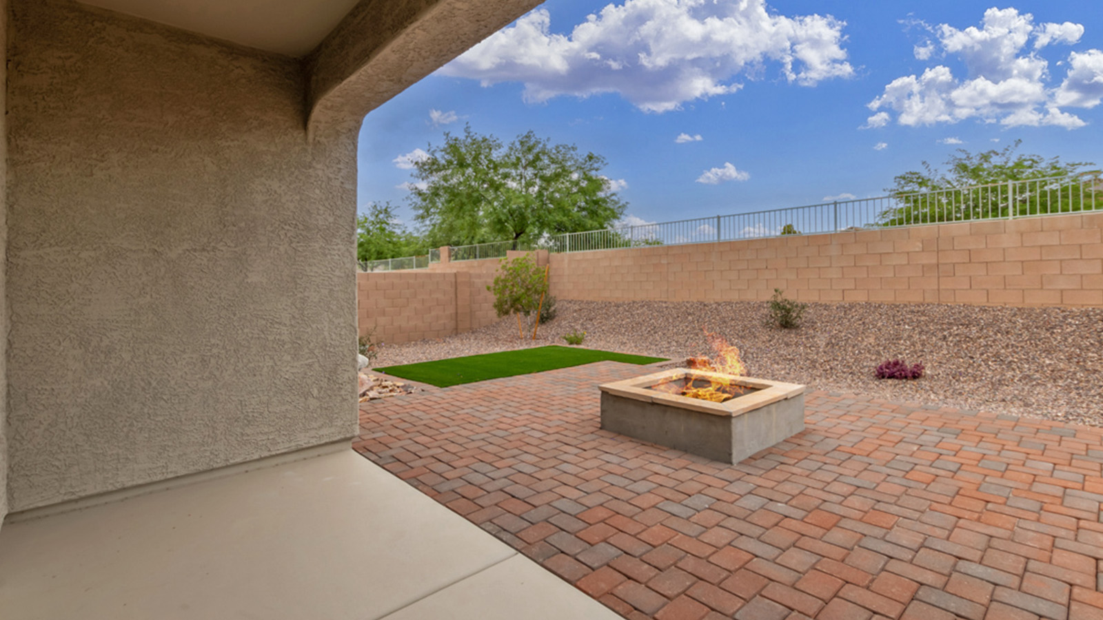 Welcome to The Amber, a thoughtfully designed single-story new home nestled in the Mesquite neighborhood at Saguaro Bloom, a master-planned community in Marana, Arizona. With 1,331 square feet of efficient living space, The Amber is perfect for those seeking a cozy yet functional home.  Step into a welcoming entryway that immediately introduces you to the home’s smart layout. The open design maximizes every square foot, with the heart of the home being the expansive great room, which flows seamlessly into the dining area and kitchen. The kitchen is well-equipped with a central island, granite countertops, and Shaker-style cabinets in either white or gray, offering a clean and modern aesthetic. A dedicated walk-in pantry adds extra storage, ensuring that all your culinary essentials are within reach.  The Amber offers three comfortable bedrooms, providing ample space for rest and relaxation. The primary suite is situated at the rear of the home, providing a sense of privacy. It includes a walk-in closet and an en-suite bathroom that features all the essentials for convenience. The two additional bedrooms are thoughtfully placed near the front of the home, sharing access to a full bathroom, making this layout perfect for families, guests, or a home office.  Practicality meets comfort in this home, with a utility room conveniently located near the kitchen and garage, providing easy access to the laundry area and additional storage. The Amber also includes a covered patio that extends the living space outdoors, ideal for enjoying Arizona’s beautiful weather.  The Amber is located in the vibrant Saguaro Bloom community, residents enjoy access to a wide range of amenities, from swimming pools and parks to miles of scenic walking trails. Whether you’re a first-time homebuyer or looking to downsize, The Amber offers a perfect blend of comfort, style, and convenience in one of Marana’s most desirable neighborhoods.  *Images shown are for reference only. They depict The Amber sales model home and may not represent the actual home.