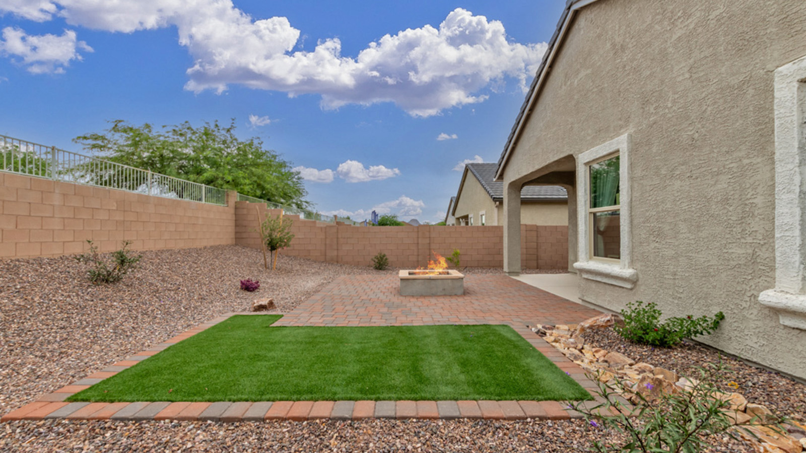Welcome to The Amber, a thoughtfully designed single-story new home nestled in the Mesquite neighborhood at Saguaro Bloom, a master-planned community in Marana, Arizona. With 1,331 square feet of efficient living space, The Amber is perfect for those seeking a cozy yet functional home.  Step into a welcoming entryway that immediately introduces you to the home’s smart layout. The open design maximizes every square foot, with the heart of the home being the expansive great room, which flows seamlessly into the dining area and kitchen. The kitchen is well-equipped with a central island, granite countertops, and Shaker-style cabinets in either white or gray, offering a clean and modern aesthetic. A dedicated walk-in pantry adds extra storage, ensuring that all your culinary essentials are within reach.  The Amber offers three comfortable bedrooms, providing ample space for rest and relaxation. The primary suite is situated at the rear of the home, providing a sense of privacy. It includes a walk-in closet and an en-suite bathroom that features all the essentials for convenience. The two additional bedrooms are thoughtfully placed near the front of the home, sharing access to a full bathroom, making this layout perfect for families, guests, or a home office.  Practicality meets comfort in this home, with a utility room conveniently located near the kitchen and garage, providing easy access to the laundry area and additional storage. The Amber also includes a covered patio that extends the living space outdoors, ideal for enjoying Arizona’s beautiful weather.  The Amber is located in the vibrant Saguaro Bloom community, residents enjoy access to a wide range of amenities, from swimming pools and parks to miles of scenic walking trails. Whether you’re a first-time homebuyer or looking to downsize, The Amber offers a perfect blend of comfort, style, and convenience in one of Marana’s most desirable neighborhoods.  *Images shown are for reference only. They depict The Amber sales model home and may not represent the actual home.