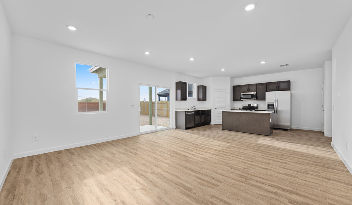 Introducing the Elm floor plan, a thoughtfully designed two-story home now available in the master planned community of Saguaro Bloom by D.R. Horton in Marana, Arizona. With 1,775 square feet of modern living space, the Elm is perfect for those seeking a cozy yet highly functional home that offers a smart separation between the private second-floor retreat and the main living areas below.  Step through the inviting front porch into a welcoming entryway that opens into the main first floor, designed to maximize every inch of space. The expansive great room flows into the dining area and kitchen, creating an ideal layout for entertaining and everyday living. The kitchen features stainless steel gas range, microwave, and dishwasher, and ample countertop and cabinetry storage. A conveniently located powder room completes the first floor. This home features a finished two-car garage accessible from the main floor.  Upstairs, the Elm offers four spacious bedrooms each with a generous closet. The primary suite provides a peaceful retreat with a walk-in closet and en-suite bathroom. The three additional bedrooms are situated just off the versatile loft area, ideal for an extra living space, game room, or home office. Everyday convenience is built in, with the laundry room and a full secondary bathroom also located on the second floor.  Step outside to a spacious backyard, where you can unwind and enjoy Marana’s beautiful weather year-round. Whether you’re sipping your morning coffee or hosting a weekend barbecue, this outdoor space serene surroundings of Saguaro Bloom.  Additionally, The Elm is equipped with D.R. Horton’s Home is Connected Smart Home package, which includes a smart thermostat, video doorbell, keyless entry, and Wi-Fi® enabled garage door opener.  Residents of Saguaro Bloom enjoy an array of community amenities, including a clubhouse, two pools with lap lanes and lagoon entry, a fitness center, a splash pad, and over 30 miles of walking trails. The community also features more than 20 pocket parks, playgrounds, and coming soon, a large community park with tennis, pickleball, soccer, baseball, and a dog park.  Located in the highly-rated Marana Unified School District, Saguaro Bloom is close to excellent schools, including Rattlesnake Ridge Elementary, Marana Middle School, and Marana High School.