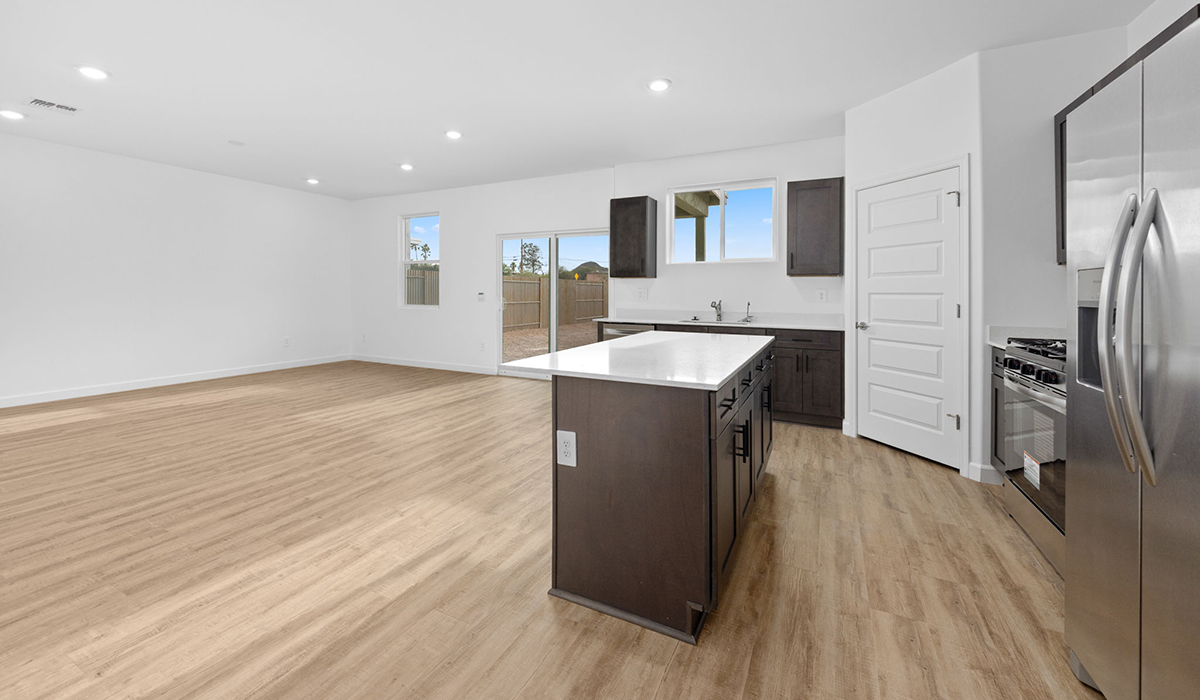 Introducing the Elm floor plan, a thoughtfully designed two-story home now available in the master planned community of Saguaro Bloom by D.R. Horton in Marana, Arizona. With 1,775 square feet of modern living space, the Elm is perfect for those seeking a cozy yet highly functional home that offers a smart separation between the private second-floor retreat and the main living areas below.  Step through the inviting front porch into a welcoming entryway that opens into the main first floor, designed to maximize every inch of space. The expansive great room flows into the dining area and kitchen, creating an ideal layout for entertaining and everyday living. The kitchen features stainless steel gas range, microwave, and dishwasher, and ample countertop and cabinetry storage. A conveniently located powder room completes the first floor. This home features a finished two-car garage accessible from the main floor.  Upstairs, the Elm offers four spacious bedrooms each with a generous closet. The primary suite provides a peaceful retreat with a walk-in closet and en-suite bathroom. The three additional bedrooms are situated just off the versatile loft area, ideal for an extra living space, game room, or home office. Everyday convenience is built in, with the laundry room and a full secondary bathroom also located on the second floor.  Step outside to a spacious backyard, where you can unwind and enjoy Marana’s beautiful weather year-round. Whether you’re sipping your morning coffee or hosting a weekend barbecue, this outdoor space serene surroundings of Saguaro Bloom.  Additionally, The Elm is equipped with D.R. Horton’s Home is Connected Smart Home package, which includes a smart thermostat, video doorbell, keyless entry, and Wi-Fi® enabled garage door opener.  Residents of Saguaro Bloom enjoy an array of community amenities, including a clubhouse, two pools with lap lanes and lagoon entry, a fitness center, a splash pad, and over 30 miles of walking trails. The community also features more than 20 pocket parks, playgrounds, and coming soon, a large community park with tennis, pickleball, soccer, baseball, and a dog park.  Located in the highly-rated Marana Unified School District, Saguaro Bloom is close to excellent schools, including Rattlesnake Ridge Elementary, Marana Middle School, and Marana High School.