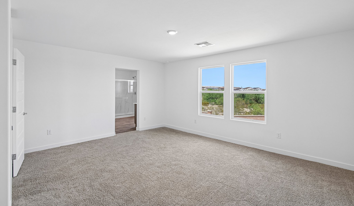 Introducing The Kleindale, a brand new stunning two-story home within the master-planned community of Saguaro Bloom by D.R. Horton in Marana, Arizona.  This spacious and beautifully designed two-story home offers 2,406 sq. ft., five bedrooms, three full bathrooms, and a two-car garage. This impressive layout is ideal for large households, multigenerational living, or anyone who simply wants room to grow, gather, and live comfortably.  A welcoming front porch leads you into the entryway, which flows into the expansive open-concept great room, dining area, and kitchen. The kitchen features stainless steel gas range, microwave, and dishwasher, and plenty of storage space. With thoughtful design and abundant natural light, the main floor truly feels like the heart of the home.  One of the standout features of The Kleindale is the fifth bedroom located on the main floor with convenient access to a full bathroom, making it perfect for a guest suite or private home office.  A spacious and private second floor continues the living space with a generous loft leading to the primary bedroom, complete with an en-suite bathroom and large walk-in closet. Three additional bedrooms are also located on the second floor each offering plenty of space for family, guests, or work-from-home needs. The upstairs also includes a full bathroom and laundry room.  Our homes at Saguaro Bloom are designed with the future in mind. Each home features a light lace stucco exterior, landscaped front yards with auto drip irrigation, and large backyards that are fully fenced and ready for your personal touch. Inside, the Home is Connected® Smart Home package brings modern convenience to your fingertips with a smart thermostat, video doorbell, keyless entry, and a Wi-Fi® enabled garage door opener.  Step outside to a spacious backyard, where you can unwind and enjoy Marana’s beautiful weather year-round. Whether you’re sipping your morning coffee or hosting a weekend barbecue, this outdoor space serene surroundings of Saguaro Bloom.  With its expansive living spaces, flexible bedroom arrangements, and thoughtful deign throughout, The Kleindale offers the ultimate combination of comfort, convenience, and room to thrive.  Residents of Saguaro Bloom enjoy an array of community amenities, including a clubhouse, two pools with lap lanes and lagoon entry, a fitness center, a splash pad, and over 30 miles of walking trails. The community also features more than 20 pocket parks, playgrounds, and coming soon, a large community park with tennis, pickleball, soccer, baseball, and a dog park.  Located in the highly-rated Marana Unified School District, Saguaro Bloom is close to excellent schools, including Rattlesnake Ridge Elementary, Marana Middle School, and Marana High School.  *Images shown are for reference only. They depict The Kleindale specs home and may not represent the actual home.