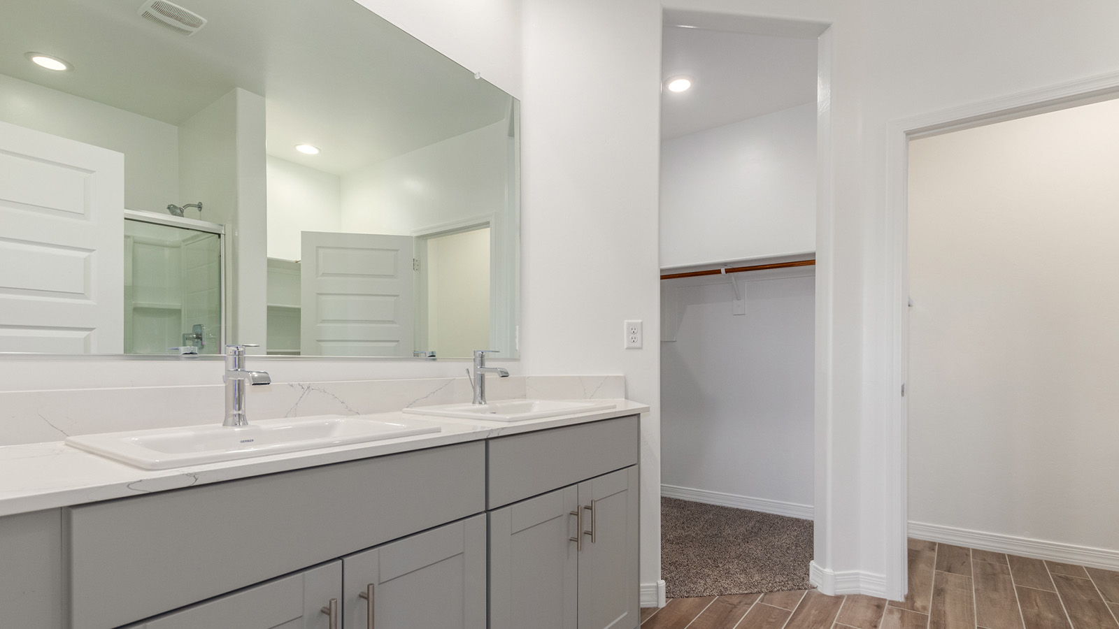 Introducing The Catalina, an expansive single-story home set in the serene and spacious Sahuarita Acres community. Covering 2,392 square feet, this residence offers four bedrooms and three bathrooms, perfectly balancing space and functionality for modern family living.  As you step into The Catalina, the entryway opens up to reveal a generous dining room that leads directly into the heart of the home—the great room. This central living space is designed for both relaxation and entertainment, with large windows that invite abundant natural light. The adjoining kitchen, complete with a large island, quartz countertops, and 42” upper cabinets, is as practical as it is stylish. A walk-in pantry provides ample storage, ensuring that everything you need is at your fingertips.  The primary bedroom, located in its own private wing, features a spacious walk-in closet and an en-suite bathroom equipped with dual sinks and a luxurious shower, offering a perfect space for winding down after a busy day. The additional three bedrooms are well-spaced throughout the home, each offering easy access to one of the two additional bathrooms, making it ideal for family living or hosting guests.  One of the standout features of The Catalina is its seamless blend of indoor and outdoor living. The covered patio, accessible from the great room, is an ideal spot for outdoor dining or simply enjoying the expansive one-acre lot that comes with each home in Sahuarita Acres. Whether you envision a garden, a play area, or even a pool, the possibilities are endless with the amount of outdoor space available.  The Catalina also includes a three-car garage and ample driveway space, perfect for parking vehicles, RVs, or additional storage. With D.R. Horton’s Home is Connected® Smart Home package, this home ensures you stay connected and secure, featuring a smart thermostat, video doorbell, keyless entry, a Wi-Fi-enabled garage door opener, and more.  Built with energy efficiency in mind, The Catalina features spray foam insulation and meets DOE Zero Energy Ready Home standards, helping you save on energy costs while contributing to a greener environment.  Nestled in the tranquil Sahuarita Acres community, residents enjoy the best of both worlds—peaceful, spacious living with easy access to urban amenities and outdoor recreation. With its combination of modern conveniences, thoughtful design, and expansive lots, The Catalina offers a lifestyle that truly captures the essence of Arizona living.