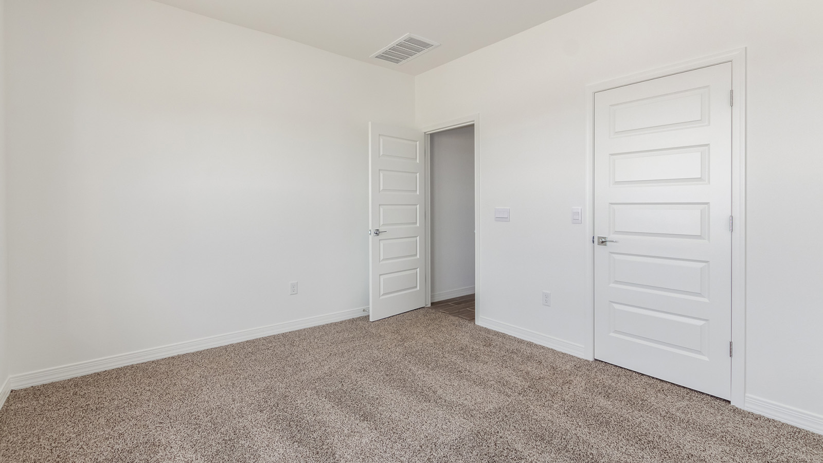 Introducing The Catalina, an expansive single-story home set in the serene and spacious Sahuarita Acres community. Covering 2,392 square feet, this residence offers four bedrooms and three bathrooms, perfectly balancing space and functionality for modern family living.  As you step into The Catalina, the entryway opens up to reveal a generous dining room that leads directly into the heart of the home—the great room. This central living space is designed for both relaxation and entertainment, with large windows that invite abundant natural light. The adjoining kitchen, complete with a large island, quartz countertops, and 42” upper cabinets, is as practical as it is stylish. A walk-in pantry provides ample storage, ensuring that everything you need is at your fingertips.  The primary bedroom, located in its own private wing, features a spacious walk-in closet and an en-suite bathroom equipped with dual sinks and a luxurious shower, offering a perfect space for winding down after a busy day. The additional three bedrooms are well-spaced throughout the home, each offering easy access to one of the two additional bathrooms, making it ideal for family living or hosting guests.  One of the standout features of The Catalina is its seamless blend of indoor and outdoor living. The covered patio, accessible from the great room, is an ideal spot for outdoor dining or simply enjoying the expansive one-acre lot that comes with each home in Sahuarita Acres. Whether you envision a garden, a play area, or even a pool, the possibilities are endless with the amount of outdoor space available.  The Catalina also includes a three-car garage and ample driveway space, perfect for parking vehicles, RVs, or additional storage. With D.R. Horton’s Home is Connected® Smart Home package, this home ensures you stay connected and secure, featuring a smart thermostat, video doorbell, keyless entry, a Wi-Fi-enabled garage door opener, and more.  Built with energy efficiency in mind, The Catalina features spray foam insulation and meets DOE Zero Energy Ready Home standards, helping you save on energy costs while contributing to a greener environment.  Nestled in the tranquil Sahuarita Acres community, residents enjoy the best of both worlds—peaceful, spacious living with easy access to urban amenities and outdoor recreation. With its combination of modern conveniences, thoughtful design, and expansive lots, The Catalina offers a lifestyle that truly captures the essence of Arizona living.