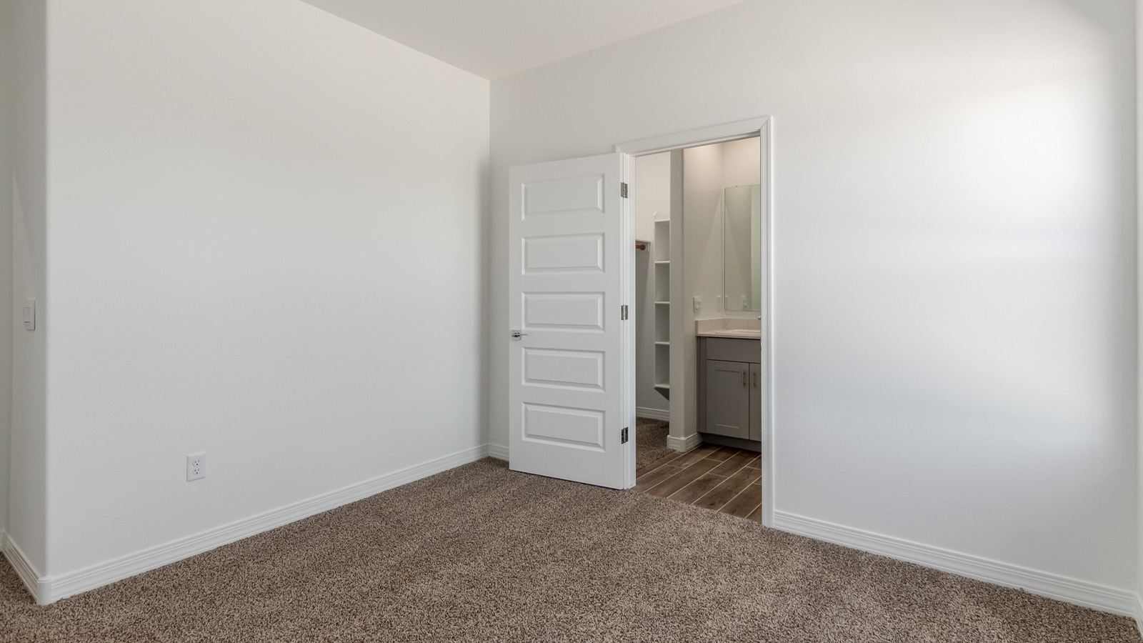 Introducing The Catalina, an expansive single-story home set in the serene and spacious Sahuarita Acres community. Covering 2,392 square feet, this residence offers four bedrooms and three bathrooms, perfectly balancing space and functionality for modern family living.  As you step into The Catalina, the entryway opens up to reveal a generous dining room that leads directly into the heart of the home—the great room. This central living space is designed for both relaxation and entertainment, with large windows that invite abundant natural light. The adjoining kitchen, complete with a large island, quartz countertops, and 42” upper cabinets, is as practical as it is stylish. A walk-in pantry provides ample storage, ensuring that everything you need is at your fingertips.  The primary bedroom, located in its own private wing, features a spacious walk-in closet and an en-suite bathroom equipped with dual sinks and a luxurious shower, offering a perfect space for winding down after a busy day. The additional three bedrooms are well-spaced throughout the home, each offering easy access to one of the two additional bathrooms, making it ideal for family living or hosting guests.  One of the standout features of The Catalina is its seamless blend of indoor and outdoor living. The covered patio, accessible from the great room, is an ideal spot for outdoor dining or simply enjoying the expansive one-acre lot that comes with each home in Sahuarita Acres. Whether you envision a garden, a play area, or even a pool, the possibilities are endless with the amount of outdoor space available.  The Catalina also includes a three-car garage and ample driveway space, perfect for parking vehicles, RVs, or additional storage. With D.R. Horton’s Home is Connected® Smart Home package, this home ensures you stay connected and secure, featuring a smart thermostat, video doorbell, keyless entry, a Wi-Fi-enabled garage door opener, and more.  Built with energy efficiency in mind, The Catalina features spray foam insulation and meets DOE Zero Energy Ready Home standards, helping you save on energy costs while contributing to a greener environment.  Nestled in the tranquil Sahuarita Acres community, residents enjoy the best of both worlds—peaceful, spacious living with easy access to urban amenities and outdoor recreation. With its combination of modern conveniences, thoughtful design, and expansive lots, The Catalina offers a lifestyle that truly captures the essence of Arizona living.