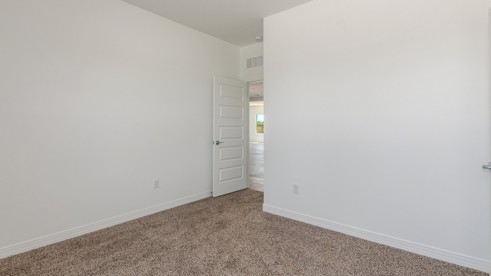 Introducing The Catalina, an expansive single-story home set in the serene and spacious Sahuarita Acres community. Covering 2,392 square feet, this residence offers four bedrooms and three bathrooms, perfectly balancing space and functionality for modern family living.  As you step into The Catalina, the entryway opens up to reveal a generous dining room that leads directly into the heart of the home—the great room. This central living space is designed for both relaxation and entertainment, with large windows that invite abundant natural light. The adjoining kitchen, complete with a large island, quartz countertops, and 42” upper cabinets, is as practical as it is stylish. A walk-in pantry provides ample storage, ensuring that everything you need is at your fingertips.  The primary bedroom, located in its own private wing, features a spacious walk-in closet and an en-suite bathroom equipped with dual sinks and a luxurious shower, offering a perfect space for winding down after a busy day. The additional three bedrooms are well-spaced throughout the home, each offering easy access to one of the two additional bathrooms, making it ideal for family living or hosting guests.  One of the standout features of The Catalina is its seamless blend of indoor and outdoor living. The covered patio, accessible from the great room, is an ideal spot for outdoor dining or simply enjoying the expansive one-acre lot that comes with each home in Sahuarita Acres. Whether you envision a garden, a play area, or even a pool, the possibilities are endless with the amount of outdoor space available.  The Catalina also includes a three-car garage and ample driveway space, perfect for parking vehicles, RVs, or additional storage. With D.R. Horton’s Home is Connected® Smart Home package, this home ensures you stay connected and secure, featuring a smart thermostat, video doorbell, keyless entry, a Wi-Fi-enabled garage door opener, and more.  Built with energy efficiency in mind, The Catalina features spray foam insulation and meets DOE Zero Energy Ready Home standards, helping you save on energy costs while contributing to a greener environment.  Nestled in the tranquil Sahuarita Acres community, residents enjoy the best of both worlds—peaceful, spacious living with easy access to urban amenities and outdoor recreation. With its combination of modern conveniences, thoughtful design, and expansive lots, The Catalina offers a lifestyle that truly captures the essence of Arizona living.