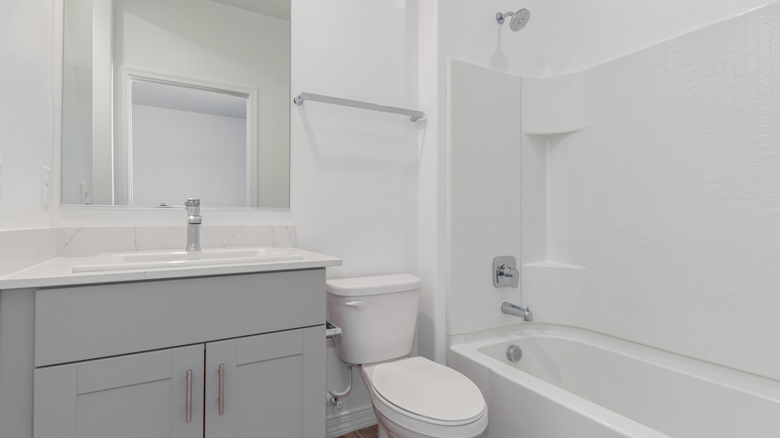 Introducing The Catalina, an expansive single-story home set in the serene and spacious Sahuarita Acres community. Covering 2,392 square feet, this residence offers four bedrooms and three bathrooms, perfectly balancing space and functionality for modern family living.  As you step into The Catalina, the entryway opens up to reveal a generous dining room that leads directly into the heart of the home—the great room. This central living space is designed for both relaxation and entertainment, with large windows that invite abundant natural light. The adjoining kitchen, complete with a large island, quartz countertops, and 42” upper cabinets, is as practical as it is stylish. A walk-in pantry provides ample storage, ensuring that everything you need is at your fingertips.  The primary bedroom, located in its own private wing, features a spacious walk-in closet and an en-suite bathroom equipped with dual sinks and a luxurious shower, offering a perfect space for winding down after a busy day. The additional three bedrooms are well-spaced throughout the home, each offering easy access to one of the two additional bathrooms, making it ideal for family living or hosting guests.  One of the standout features of The Catalina is its seamless blend of indoor and outdoor living. The covered patio, accessible from the great room, is an ideal spot for outdoor dining or simply enjoying the expansive one-acre lot that comes with each home in Sahuarita Acres. Whether you envision a garden, a play area, or even a pool, the possibilities are endless with the amount of outdoor space available.  The Catalina also includes a three-car garage and ample driveway space, perfect for parking vehicles, RVs, or additional storage. With D.R. Horton’s Home is Connected® Smart Home package, this home ensures you stay connected and secure, featuring a smart thermostat, video doorbell, keyless entry, a Wi-Fi-enabled garage door opener, and more.  Built with energy efficiency in mind, The Catalina features spray foam insulation and meets DOE Zero Energy Ready Home standards, helping you save on energy costs while contributing to a greener environment.  Nestled in the tranquil Sahuarita Acres community, residents enjoy the best of both worlds—peaceful, spacious living with easy access to urban amenities and outdoor recreation. With its combination of modern conveniences, thoughtful design, and expansive lots, The Catalina offers a lifestyle that truly captures the essence of Arizona living.