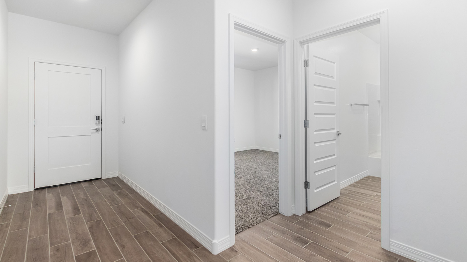 Welcome to The Sedona, a spacious and elegant single-story new home nestled in the expansive Sahuarita Acres community. Offering 2,530 square feet of living space, this home features five bedrooms and three bathrooms, designed to accommodate both comfort and functionality for modern family living.  As you step through the charming front porch, you are greeted by an inviting entryway that opens into a thoughtfully arranged interior. The heart of the home is the expansive great room, which seamlessly connects to the dining area and kitchen. This open-concept layout is perfect for those who enjoy entertaining or simply want a space where family life can flow naturally. The kitchen is a culinary haven, featuring a large island, sleek quartz countertops, and ample 42” upper cabinets for all your storage needs. A walk-in pantry ensures that your kitchen remains organized and efficient.  The primary bedroom is situated in its own private wing, offering a spacious walk-in closet and an en-suite bathroom with dual sinks and a luxurious shower. This room is designed as a peaceful haven, providing the perfect space to unwind at the end of the day. The additional four bedrooms are well-positioned within the home, each with easy access to one of the two additional bathrooms, making this layout ideal for families or hosting guests.  Outdoor living is a highlight of The Sedona, with a covered patio that extends from the great room, offering a seamless transition between indoor and outdoor spaces. Whether you envision hosting summer barbecues or simply enjoying the tranquility of your expansive one-acre lot, this outdoor space is perfect for creating your ideal backyard oasis.  Practical features of The Sedona include a three-car garage, which provides ample space for vehicles, storage, or even a workshop. The utility room is conveniently located near the kitchen, making household chores more manageable.  In line with modern living, The Sedona is equipped with D.R. Horton’s Home is Connected® Smart Home package, which includes a smart thermostat, video doorbell, keyless entry, a Wi-Fi-enabled garage door opener and more. The home is also designed with energy efficiency in mind, featuring spray foam insulation and meeting DOE Zero Energy Ready Home standards, ensuring long-term savings and environmental benefits.  Located within the peaceful Sahuarita Acres community, The Sedona offers residents the best of both worlds—spacious living with the conveniences of nearby urban amenities. Just 30 minutes from downtown Tucson and close to local attractions like the Titan Missile Museum and Madera Canyon, this home offers a lifestyle that embraces the essence of Arizona living.