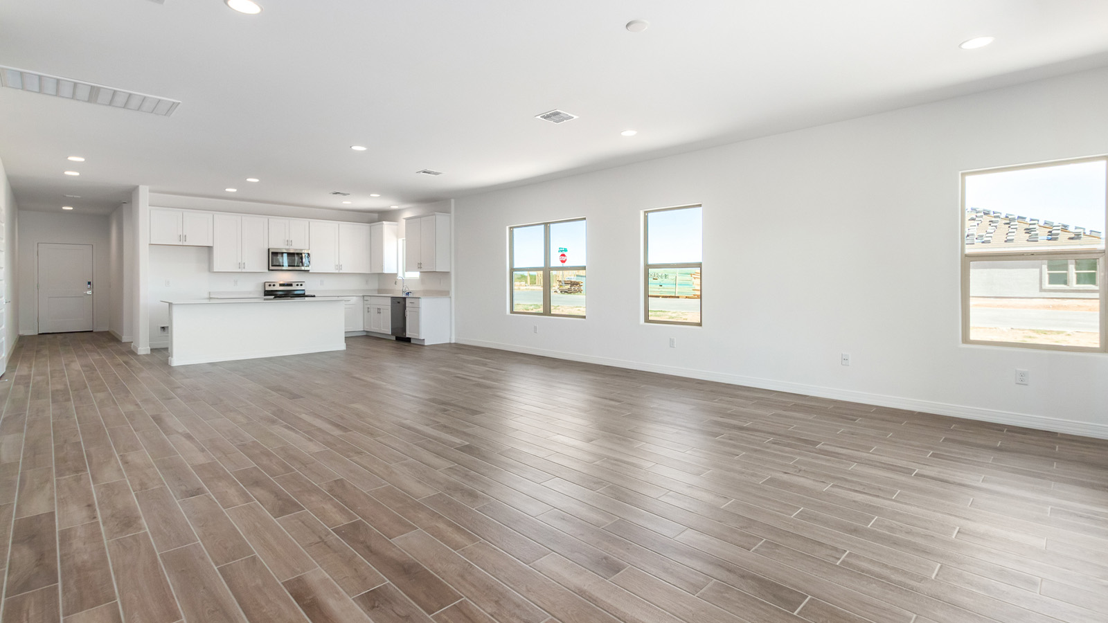 Welcome to The Sedona, a spacious and elegant single-story new home nestled in the expansive Sahuarita Acres community. Offering 2,530 square feet of living space, this home features five bedrooms and three bathrooms, designed to accommodate both comfort and functionality for modern family living.  As you step through the charming front porch, you are greeted by an inviting entryway that opens into a thoughtfully arranged interior. The heart of the home is the expansive great room, which seamlessly connects to the dining area and kitchen. This open-concept layout is perfect for those who enjoy entertaining or simply want a space where family life can flow naturally. The kitchen is a culinary haven, featuring a large island, sleek quartz countertops, and ample 42” upper cabinets for all your storage needs. A walk-in pantry ensures that your kitchen remains organized and efficient.  The primary bedroom is situated in its own private wing, offering a spacious walk-in closet and an en-suite bathroom with dual sinks and a luxurious shower. This room is designed as a peaceful haven, providing the perfect space to unwind at the end of the day. The additional four bedrooms are well-positioned within the home, each with easy access to one of the two additional bathrooms, making this layout ideal for families or hosting guests.  Outdoor living is a highlight of The Sedona, with a covered patio that extends from the great room, offering a seamless transition between indoor and outdoor spaces. Whether you envision hosting summer barbecues or simply enjoying the tranquility of your expansive one-acre lot, this outdoor space is perfect for creating your ideal backyard oasis.  Practical features of The Sedona include a three-car garage, which provides ample space for vehicles, storage, or even a workshop. The utility room is conveniently located near the kitchen, making household chores more manageable.  In line with modern living, The Sedona is equipped with D.R. Horton’s Home is Connected® Smart Home package, which includes a smart thermostat, video doorbell, keyless entry, a Wi-Fi-enabled garage door opener and more. The home is also designed with energy efficiency in mind, featuring spray foam insulation and meeting DOE Zero Energy Ready Home standards, ensuring long-term savings and environmental benefits.  Located within the peaceful Sahuarita Acres community, The Sedona offers residents the best of both worlds—spacious living with the conveniences of nearby urban amenities. Just 30 minutes from downtown Tucson and close to local attractions like the Titan Missile Museum and Madera Canyon, this home offers a lifestyle that embraces the essence of Arizona living.