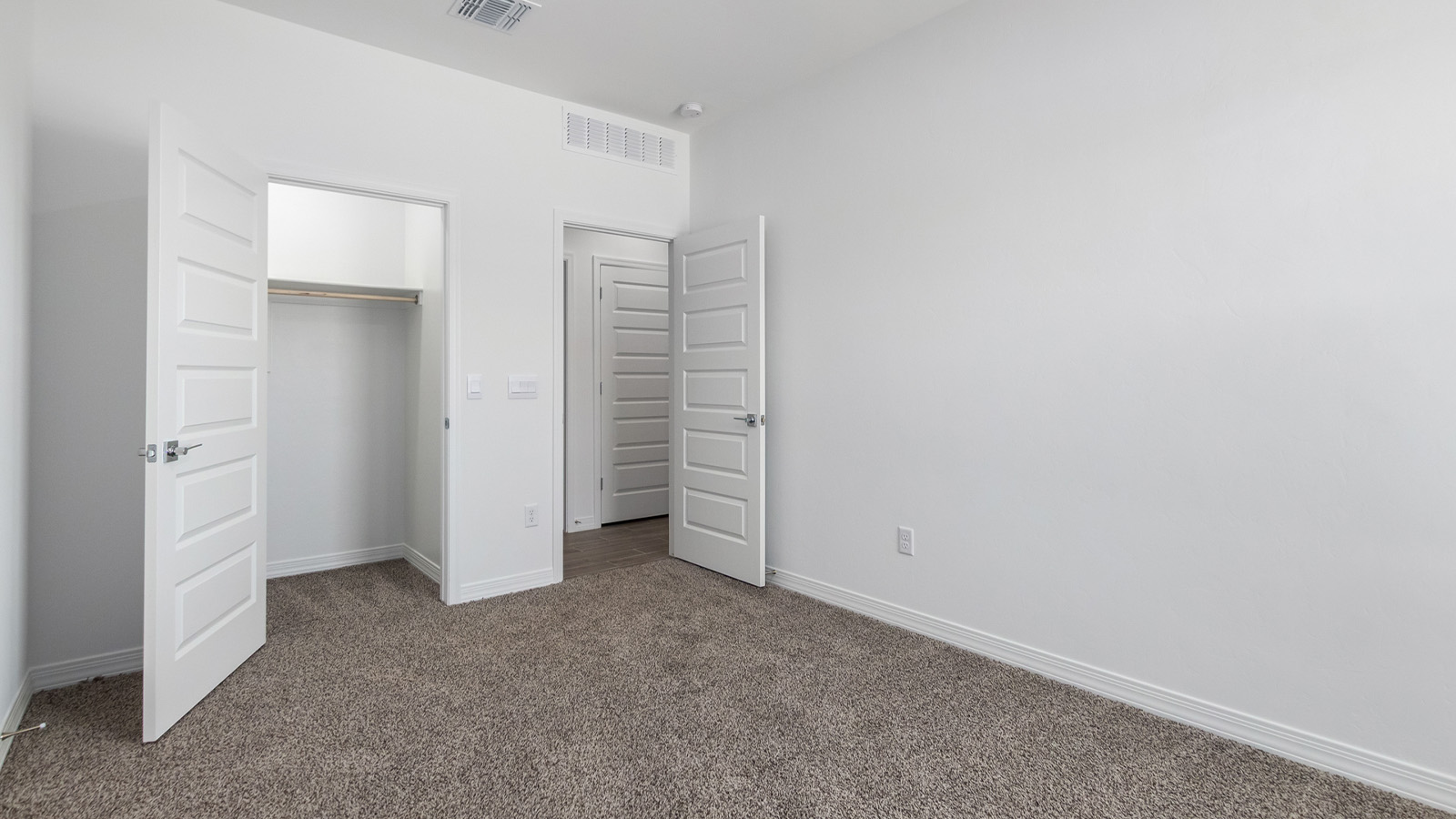 Welcome to The Sedona, a spacious and elegant single-story new home nestled in the expansive Sahuarita Acres community. Offering 2,530 square feet of living space, this home features five bedrooms and three bathrooms, designed to accommodate both comfort and functionality for modern family living.  As you step through the charming front porch, you are greeted by an inviting entryway that opens into a thoughtfully arranged interior. The heart of the home is the expansive great room, which seamlessly connects to the dining area and kitchen. This open-concept layout is perfect for those who enjoy entertaining or simply want a space where family life can flow naturally. The kitchen is a culinary haven, featuring a large island, sleek quartz countertops, and ample 42” upper cabinets for all your storage needs. A walk-in pantry ensures that your kitchen remains organized and efficient.  The primary bedroom is situated in its own private wing, offering a spacious walk-in closet and an en-suite bathroom with dual sinks and a luxurious shower. This room is designed as a peaceful haven, providing the perfect space to unwind at the end of the day. The additional four bedrooms are well-positioned within the home, each with easy access to one of the two additional bathrooms, making this layout ideal for families or hosting guests.  Outdoor living is a highlight of The Sedona, with a covered patio that extends from the great room, offering a seamless transition between indoor and outdoor spaces. Whether you envision hosting summer barbecues or simply enjoying the tranquility of your expansive one-acre lot, this outdoor space is perfect for creating your ideal backyard oasis.  Practical features of The Sedona include a three-car garage, which provides ample space for vehicles, storage, or even a workshop. The utility room is conveniently located near the kitchen, making household chores more manageable.  In line with modern living, The Sedona is equipped with D.R. Horton’s Home is Connected® Smart Home package, which includes a smart thermostat, video doorbell, keyless entry, a Wi-Fi-enabled garage door opener and more. The home is also designed with energy efficiency in mind, featuring spray foam insulation and meeting DOE Zero Energy Ready Home standards, ensuring long-term savings and environmental benefits.  Located within the peaceful Sahuarita Acres community, The Sedona offers residents the best of both worlds—spacious living with the conveniences of nearby urban amenities. Just 30 minutes from downtown Tucson and close to local attractions like the Titan Missile Museum and Madera Canyon, this home offers a lifestyle that embraces the essence of Arizona living.