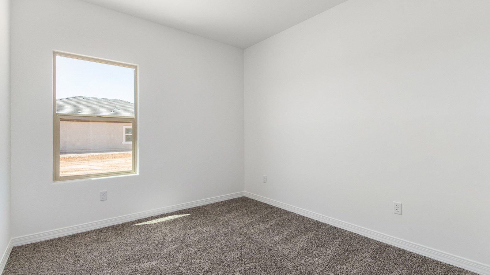 Welcome to The Sedona, a spacious and elegant single-story new home nestled in the expansive Sahuarita Acres community. Offering 2,530 square feet of living space, this home features five bedrooms and three bathrooms, designed to accommodate both comfort and functionality for modern family living.  As you step through the charming front porch, you are greeted by an inviting entryway that opens into a thoughtfully arranged interior. The heart of the home is the expansive great room, which seamlessly connects to the dining area and kitchen. This open-concept layout is perfect for those who enjoy entertaining or simply want a space where family life can flow naturally. The kitchen is a culinary haven, featuring a large island, sleek quartz countertops, and ample 42” upper cabinets for all your storage needs. A walk-in pantry ensures that your kitchen remains organized and efficient.  The primary bedroom is situated in its own private wing, offering a spacious walk-in closet and an en-suite bathroom with dual sinks and a luxurious shower. This room is designed as a peaceful haven, providing the perfect space to unwind at the end of the day. The additional four bedrooms are well-positioned within the home, each with easy access to one of the two additional bathrooms, making this layout ideal for families or hosting guests.  Outdoor living is a highlight of The Sedona, with a covered patio that extends from the great room, offering a seamless transition between indoor and outdoor spaces. Whether you envision hosting summer barbecues or simply enjoying the tranquility of your expansive one-acre lot, this outdoor space is perfect for creating your ideal backyard oasis.  Practical features of The Sedona include a three-car garage, which provides ample space for vehicles, storage, or even a workshop. The utility room is conveniently located near the kitchen, making household chores more manageable.  In line with modern living, The Sedona is equipped with D.R. Horton’s Home is Connected® Smart Home package, which includes a smart thermostat, video doorbell, keyless entry, a Wi-Fi-enabled garage door opener and more. The home is also designed with energy efficiency in mind, featuring spray foam insulation and meeting DOE Zero Energy Ready Home standards, ensuring long-term savings and environmental benefits.  Located within the peaceful Sahuarita Acres community, The Sedona offers residents the best of both worlds—spacious living with the conveniences of nearby urban amenities. Just 30 minutes from downtown Tucson and close to local attractions like the Titan Missile Museum and Madera Canyon, this home offers a lifestyle that embraces the essence of Arizona living.