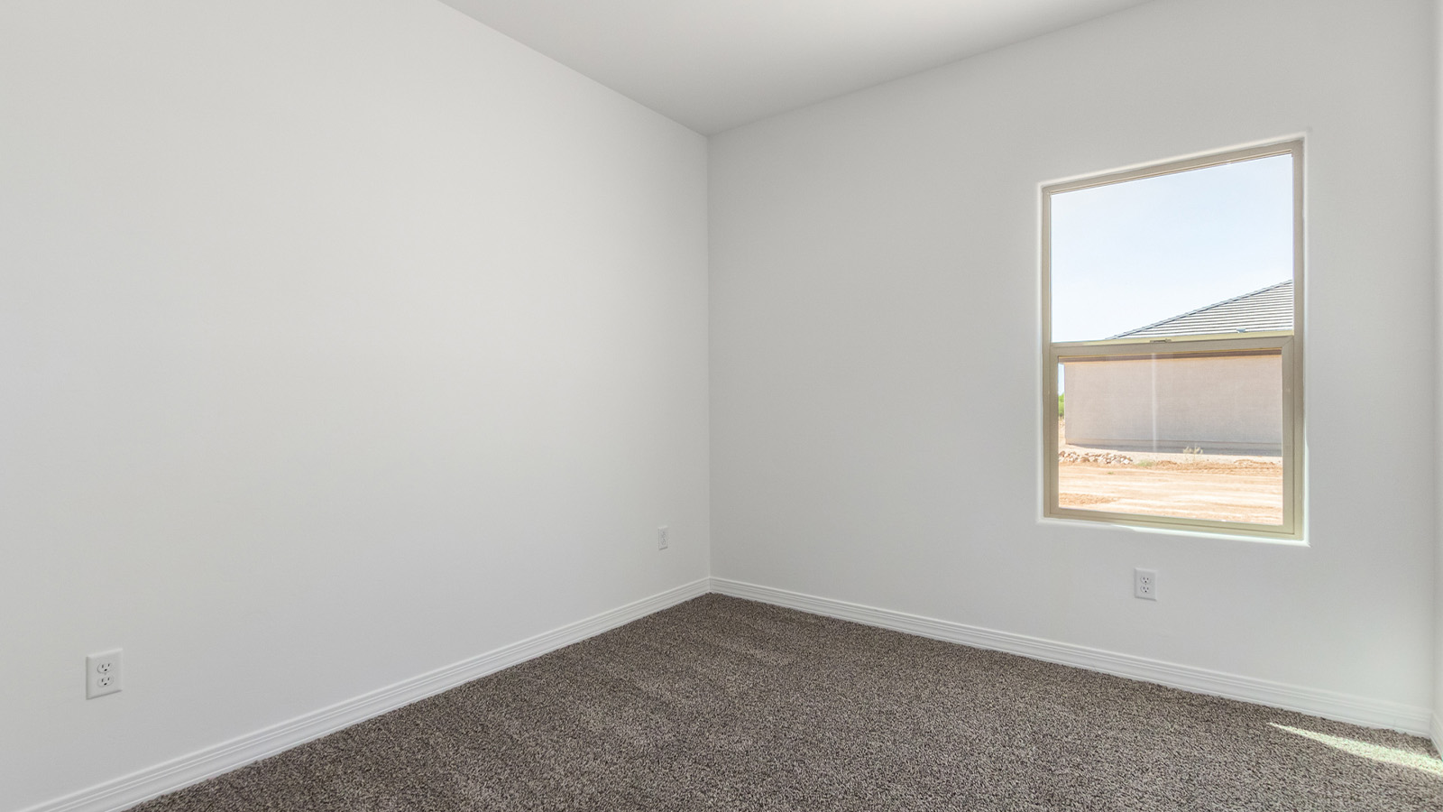 Welcome to The Sedona, a spacious and elegant single-story new home nestled in the expansive Sahuarita Acres community. Offering 2,530 square feet of living space, this home features five bedrooms and three bathrooms, designed to accommodate both comfort and functionality for modern family living.  As you step through the charming front porch, you are greeted by an inviting entryway that opens into a thoughtfully arranged interior. The heart of the home is the expansive great room, which seamlessly connects to the dining area and kitchen. This open-concept layout is perfect for those who enjoy entertaining or simply want a space where family life can flow naturally. The kitchen is a culinary haven, featuring a large island, sleek quartz countertops, and ample 42” upper cabinets for all your storage needs. A walk-in pantry ensures that your kitchen remains organized and efficient.  The primary bedroom is situated in its own private wing, offering a spacious walk-in closet and an en-suite bathroom with dual sinks and a luxurious shower. This room is designed as a peaceful haven, providing the perfect space to unwind at the end of the day. The additional four bedrooms are well-positioned within the home, each with easy access to one of the two additional bathrooms, making this layout ideal for families or hosting guests.  Outdoor living is a highlight of The Sedona, with a covered patio that extends from the great room, offering a seamless transition between indoor and outdoor spaces. Whether you envision hosting summer barbecues or simply enjoying the tranquility of your expansive one-acre lot, this outdoor space is perfect for creating your ideal backyard oasis.  Practical features of The Sedona include a three-car garage, which provides ample space for vehicles, storage, or even a workshop. The utility room is conveniently located near the kitchen, making household chores more manageable.  In line with modern living, The Sedona is equipped with D.R. Horton’s Home is Connected® Smart Home package, which includes a smart thermostat, video doorbell, keyless entry, a Wi-Fi-enabled garage door opener and more. The home is also designed with energy efficiency in mind, featuring spray foam insulation and meeting DOE Zero Energy Ready Home standards, ensuring long-term savings and environmental benefits.  Located within the peaceful Sahuarita Acres community, The Sedona offers residents the best of both worlds—spacious living with the conveniences of nearby urban amenities. Just 30 minutes from downtown Tucson and close to local attractions like the Titan Missile Museum and Madera Canyon, this home offers a lifestyle that embraces the essence of Arizona living.