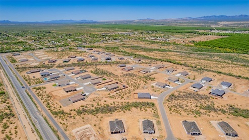 Welcome to Sahuarita Acres, where new homes by D.R. Horton offer the perfect blend of space, comfort, and modern convenience on expansive one-acre lots in the tranquil town of Sahuarita, Arizona. This unique community is designed for those who appreciate the luxury of space, with homes ranging from 1,900 to 2,600 square feet, each thoughtfully crafted with high-end finishes and features that cater to contemporary living. Sahuarita Acres provides a serene living experience with its spacious lots, perfect for creating your dream outdoor space. Whether you’re looking to park your RV, install a pool, or simply enjoy a large backyard, these one-acre homesites offer endless possibilities. The community also features walking trails that wind through the picturesque landscape, making it easy to enjoy the natural beauty of Sahuarita. Each home in Sahuarita Acres comes equipped with D.R. Horton’s Home is Connected® Smart Home package that includes a smart thermostat, video doorbell, keyless entry, a Wi-Fi-enabled garage door opener and more, ensuring that modern technology is at your fingertips. These new homes also new feature spray foam insulation for enhanced energy efficiency, RV parking with 30’ driveways, and three-car garages. Inside, you’ll find luxurious quartz countertops in the kitchens and bathrooms, 42” upper cabinets, dazzling wood-look tile flooring with thick 4 ¼ baseboards, and stainless steel appliances. These homes are also designed with energy efficiency in mind, meeting the stringent DOE Zero Energy Ready Home standards. This means your home is built to be so energy-efficient that a renewable energy system could offset most or all of the home's annual energy use, ensuring long-term savings and environmental benefits. Residents of Sahuarita Acres benefit from the peaceful, small-town charm of Sahuarita while still enjoying easy access to urban amenities. The community is just 30 minutes from downtown Tucson and only 15 miles from Davis-Monthan Air Force Base, making it an ideal location for those commuting to the city. Nearby, the Rancho Sahuarita shopping center offers a variety of dining and shopping options, including Fry’s, Dunkin’ Donuts, Starbucks, and more. Families will appreciate the excellent schools in the Sahuarita Unified School District, with Anza Trail Elementary, Anza Trail Middle School, and Walden Grove High School all located nearby. The community is also close to the popular Sahuarita Lake Park, which offers fishing, boating, and walking trails, providing ample opportunities for outdoor recreation. In addition to its scenic beauty and spacious homesites, Sahuarita Acres is close to several local attractions, including the Titan Missile Museum, Desert Diamond Casino, and the scenic Madera Canyon. Whether you’re looking to explore the outdoors or enjoy the quiet, laid-back vibe of Sahuarita, Sahuarita Acres offers a lifestyle that’s hard to match. Come home to Sahuarita Acres, where the perfect combination of space, luxury, and convenience awaits. Embrace the essence of Arizona living in this extraordinary community.