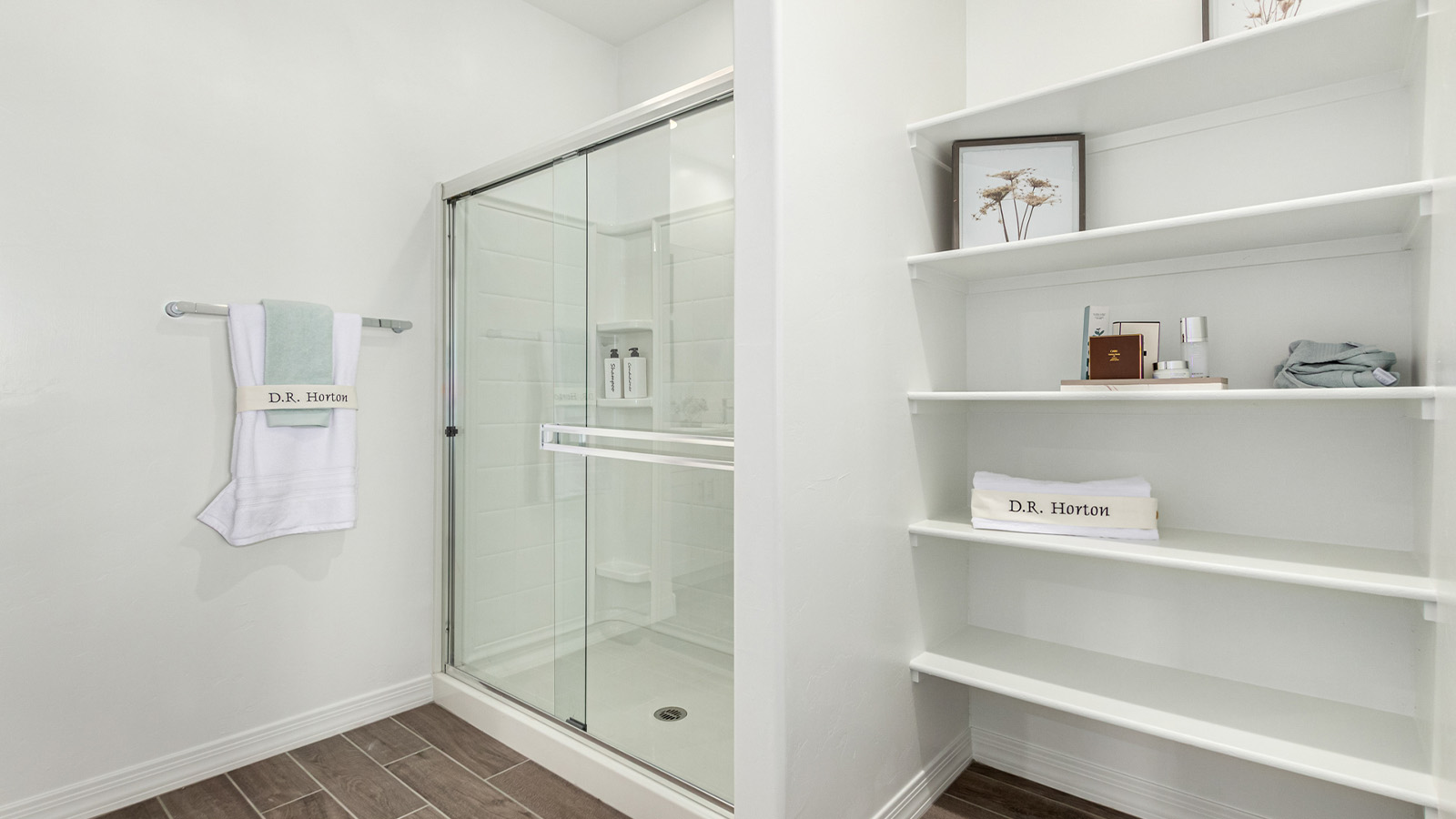 Introducing The Cali, a charming single-story new home located in the expansive Sahuarita Acres community. Covering 1,823 square feet, this home offers four bedrooms and two bathrooms, making it an excellent choice for families seeking both space and modern comfort.  As you step through the front porch and into the welcoming entryway, you’re immediately led into the heart of the home. The open-concept great room seamlessly connects to the dining area and kitchen, creating a perfect space for gathering with family and friends. The kitchen is a standout feature, boasting a central island, sleek granite countertops, and stylish 42” upper cabinets that offer ample storage. A spacious pantry adds to the kitchen’s functionality, ensuring everything you need is within reach.  The Cali’s layout is thoughtfully designed to maximize privacy and comfort. The primary bedroom, located at the rear of the home, features a large walk-in closet and an en-suite bathroom with dual sinks, providing a private space to start and end your day. The additional three bedrooms are situated toward the front of the home, each offering plenty of closet space and easy access to a full bathroom, making this layout ideal for families or guests.  One of the highlights of The Cali is the outdoor living space. The covered patio extends from the great room, offering an ideal spot to enjoy the expansive near one-acre lots that Sahuarita Acres is known for. Whether you’re planning to create a dream outdoor oasis or simply enjoy the natural surroundings, this space offers endless possibilities.  Built with modern living in mind, The Cali includes D.R. Horton’s Home is Connected® Smart Home package, featuring a smart thermostat, video doorbell, keyless entry, and a Wi-Fi-enabled garage door opener. Energy efficiency is also a priority, with spray foam insulation and designs that meet the DOE Zero Energy Ready Home standards, ensuring long-term savings and environmental benefits.  Located within the serene Sahuarita Acres community, residents of The Cali enjoy the luxury of space combined with easy access to urban amenities. With a three-car garage and RV parking on a 30’ driveway, this home is designed to accommodate your lifestyle while offering a peaceful retreat from the hustle and bustle.  Come home to The Cali, where comfort, style, and the beauty of Arizona living come together in perfect harmony.