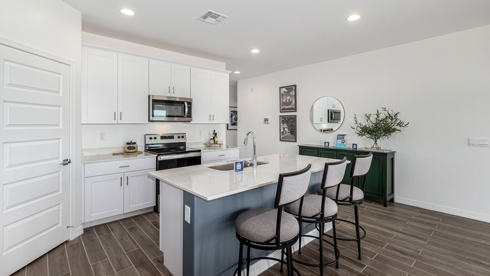 Introducing The Cali, a charming single-story new home located in the expansive Sahuarita Acres community. Covering 1,823 square feet, this home offers four bedrooms and two bathrooms, making it an excellent choice for families seeking both space and modern comfort.  As you step through the front porch and into the welcoming entryway, you’re immediately led into the heart of the home. The open-concept great room seamlessly connects to the dining area and kitchen, creating a perfect space for gathering with family and friends. The kitchen is a standout feature, boasting a central island, sleek granite countertops, and stylish 42” upper cabinets that offer ample storage. A spacious pantry adds to the kitchen’s functionality, ensuring everything you need is within reach.  The Cali’s layout is thoughtfully designed to maximize privacy and comfort. The primary bedroom, located at the rear of the home, features a large walk-in closet and an en-suite bathroom with dual sinks, providing a private space to start and end your day. The additional three bedrooms are situated toward the front of the home, each offering plenty of closet space and easy access to a full bathroom, making this layout ideal for families or guests.  One of the highlights of The Cali is the outdoor living space. The covered patio extends from the great room, offering an ideal spot to enjoy the expansive near one-acre lots that Sahuarita Acres is known for. Whether you’re planning to create a dream outdoor oasis or simply enjoy the natural surroundings, this space offers endless possibilities.  Built with modern living in mind, The Cali includes D.R. Horton’s Home is Connected® Smart Home package, featuring a smart thermostat, video doorbell, keyless entry, and a Wi-Fi-enabled garage door opener. Energy efficiency is also a priority, with spray foam insulation and designs that meet the DOE Zero Energy Ready Home standards, ensuring long-term savings and environmental benefits.  Located within the serene Sahuarita Acres community, residents of The Cali enjoy the luxury of space combined with easy access to urban amenities. With a three-car garage and RV parking on a 30’ driveway, this home is designed to accommodate your lifestyle while offering a peaceful retreat from the hustle and bustle.  Come home to The Cali, where comfort, style, and the beauty of Arizona living come together in perfect harmony.