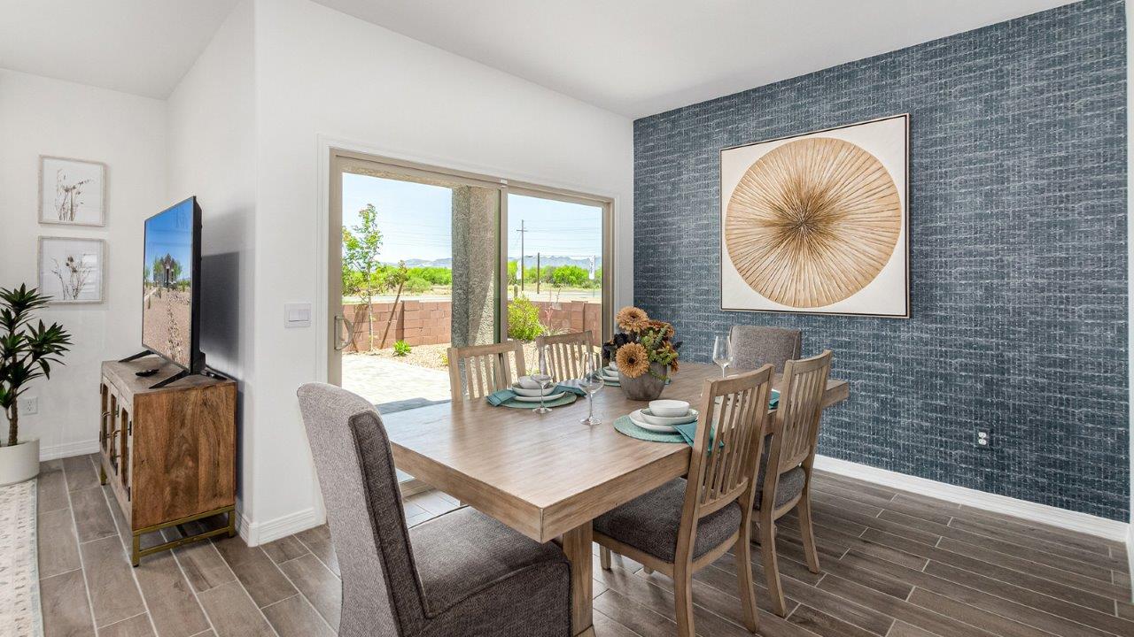 Introducing The Cali, a charming single-story new home located in the expansive Sahuarita Acres community. Covering 1,823 square feet, this home offers four bedrooms and two bathrooms, making it an excellent choice for families seeking both space and modern comfort.  As you step through the front porch and into the welcoming entryway, you’re immediately led into the heart of the home. The open-concept great room seamlessly connects to the dining area and kitchen, creating a perfect space for gathering with family and friends. The kitchen is a standout feature, boasting a central island, sleek granite countertops, and stylish 42” upper cabinets that offer ample storage. A spacious pantry adds to the kitchen’s functionality, ensuring everything you need is within reach.  The Cali’s layout is thoughtfully designed to maximize privacy and comfort. The primary bedroom, located at the rear of the home, features a large walk-in closet and an en-suite bathroom with dual sinks, providing a private space to start and end your day. The additional three bedrooms are situated toward the front of the home, each offering plenty of closet space and easy access to a full bathroom, making this layout ideal for families or guests.  One of the highlights of The Cali is the outdoor living space. The covered patio extends from the great room, offering an ideal spot to enjoy the expansive near one-acre lots that Sahuarita Acres is known for. Whether you’re planning to create a dream outdoor oasis or simply enjoy the natural surroundings, this space offers endless possibilities.  Built with modern living in mind, The Cali includes D.R. Horton’s Home is Connected® Smart Home package, featuring a smart thermostat, video doorbell, keyless entry, and a Wi-Fi-enabled garage door opener. Energy efficiency is also a priority, with spray foam insulation and designs that meet the DOE Zero Energy Ready Home standards, ensuring long-term savings and environmental benefits.  Located within the serene Sahuarita Acres community, residents of The Cali enjoy the luxury of space combined with easy access to urban amenities. With a three-car garage and RV parking on a 30’ driveway, this home is designed to accommodate your lifestyle while offering a peaceful retreat from the hustle and bustle.  Come home to The Cali, where comfort, style, and the beauty of Arizona living come together in perfect harmony.