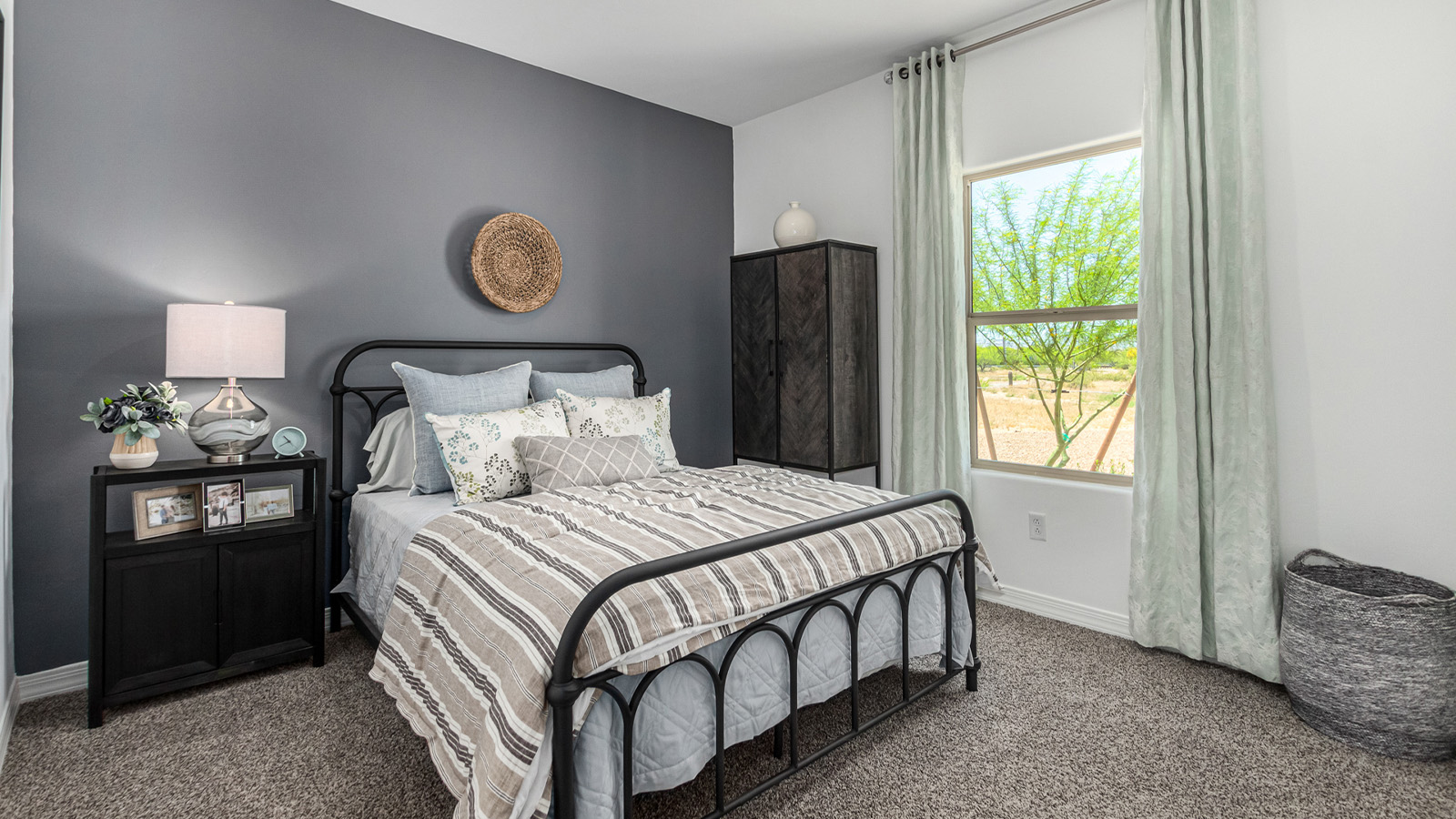 Introducing The Cali, a charming single-story new home located in the expansive Sahuarita Acres community. Covering 1,823 square feet, this home offers four bedrooms and two bathrooms, making it an excellent choice for families seeking both space and modern comfort.  As you step through the front porch and into the welcoming entryway, you’re immediately led into the heart of the home. The open-concept great room seamlessly connects to the dining area and kitchen, creating a perfect space for gathering with family and friends. The kitchen is a standout feature, boasting a central island, sleek granite countertops, and stylish 42” upper cabinets that offer ample storage. A spacious pantry adds to the kitchen’s functionality, ensuring everything you need is within reach.  The Cali’s layout is thoughtfully designed to maximize privacy and comfort. The primary bedroom, located at the rear of the home, features a large walk-in closet and an en-suite bathroom with dual sinks, providing a private space to start and end your day. The additional three bedrooms are situated toward the front of the home, each offering plenty of closet space and easy access to a full bathroom, making this layout ideal for families or guests.  One of the highlights of The Cali is the outdoor living space. The covered patio extends from the great room, offering an ideal spot to enjoy the expansive near one-acre lots that Sahuarita Acres is known for. Whether you’re planning to create a dream outdoor oasis or simply enjoy the natural surroundings, this space offers endless possibilities.  Built with modern living in mind, The Cali includes D.R. Horton’s Home is Connected® Smart Home package, featuring a smart thermostat, video doorbell, keyless entry, and a Wi-Fi-enabled garage door opener. Energy efficiency is also a priority, with spray foam insulation and designs that meet the DOE Zero Energy Ready Home standards, ensuring long-term savings and environmental benefits.  Located within the serene Sahuarita Acres community, residents of The Cali enjoy the luxury of space combined with easy access to urban amenities. With a three-car garage and RV parking on a 30’ driveway, this home is designed to accommodate your lifestyle while offering a peaceful retreat from the hustle and bustle.  Come home to The Cali, where comfort, style, and the beauty of Arizona living come together in perfect harmony.