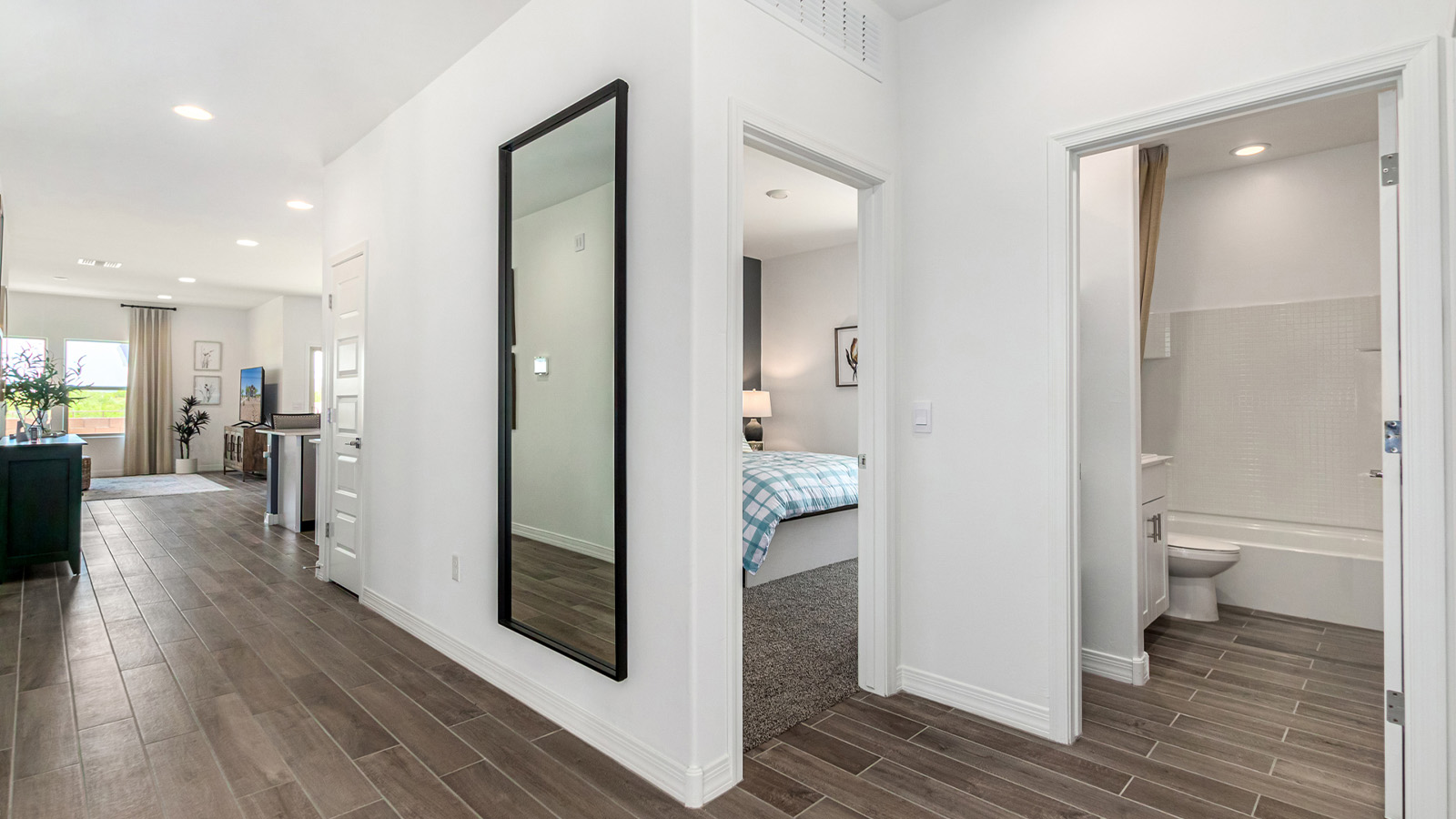 Introducing The Cali, a charming single-story new home located in the expansive Sahuarita Acres community. Covering 1,823 square feet, this home offers four bedrooms and two bathrooms, making it an excellent choice for families seeking both space and modern comfort.  As you step through the front porch and into the welcoming entryway, you’re immediately led into the heart of the home. The open-concept great room seamlessly connects to the dining area and kitchen, creating a perfect space for gathering with family and friends. The kitchen is a standout feature, boasting a central island, sleek granite countertops, and stylish 42” upper cabinets that offer ample storage. A spacious pantry adds to the kitchen’s functionality, ensuring everything you need is within reach.  The Cali’s layout is thoughtfully designed to maximize privacy and comfort. The primary bedroom, located at the rear of the home, features a large walk-in closet and an en-suite bathroom with dual sinks, providing a private space to start and end your day. The additional three bedrooms are situated toward the front of the home, each offering plenty of closet space and easy access to a full bathroom, making this layout ideal for families or guests.  One of the highlights of The Cali is the outdoor living space. The covered patio extends from the great room, offering an ideal spot to enjoy the expansive near one-acre lots that Sahuarita Acres is known for. Whether you’re planning to create a dream outdoor oasis or simply enjoy the natural surroundings, this space offers endless possibilities.  Built with modern living in mind, The Cali includes D.R. Horton’s Home is Connected® Smart Home package, featuring a smart thermostat, video doorbell, keyless entry, and a Wi-Fi-enabled garage door opener. Energy efficiency is also a priority, with spray foam insulation and designs that meet the DOE Zero Energy Ready Home standards, ensuring long-term savings and environmental benefits.  Located within the serene Sahuarita Acres community, residents of The Cali enjoy the luxury of space combined with easy access to urban amenities. With a three-car garage and RV parking on a 30’ driveway, this home is designed to accommodate your lifestyle while offering a peaceful retreat from the hustle and bustle.  Come home to The Cali, where comfort, style, and the beauty of Arizona living come together in perfect harmony.