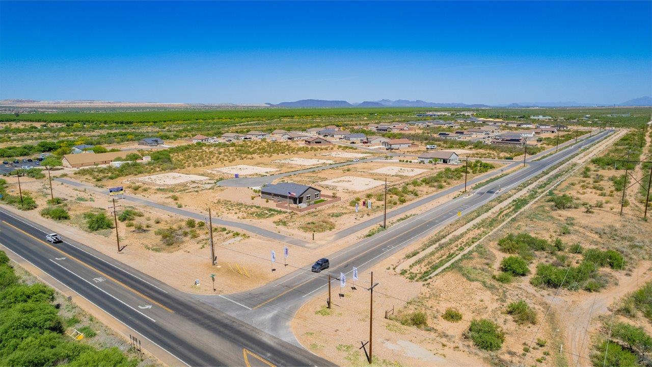 Introducing The Cali, a charming single-story new home located in the expansive Sahuarita Acres community. Covering 1,823 square feet, this home offers four bedrooms and two bathrooms, making it an excellent choice for families seeking both space and modern comfort.  As you step through the front porch and into the welcoming entryway, you’re immediately led into the heart of the home. The open-concept great room seamlessly connects to the dining area and kitchen, creating a perfect space for gathering with family and friends. The kitchen is a standout feature, boasting a central island, sleek granite countertops, and stylish 42” upper cabinets that offer ample storage. A spacious pantry adds to the kitchen’s functionality, ensuring everything you need is within reach.  The Cali’s layout is thoughtfully designed to maximize privacy and comfort. The primary bedroom, located at the rear of the home, features a large walk-in closet and an en-suite bathroom with dual sinks, providing a private space to start and end your day. The additional three bedrooms are situated toward the front of the home, each offering plenty of closet space and easy access to a full bathroom, making this layout ideal for families or guests.  One of the highlights of The Cali is the outdoor living space. The covered patio extends from the great room, offering an ideal spot to enjoy the expansive near one-acre lots that Sahuarita Acres is known for. Whether you’re planning to create a dream outdoor oasis or simply enjoy the natural surroundings, this space offers endless possibilities.  Built with modern living in mind, The Cali includes D.R. Horton’s Home is Connected® Smart Home package, featuring a smart thermostat, video doorbell, keyless entry, and a Wi-Fi-enabled garage door opener. Energy efficiency is also a priority, with spray foam insulation and designs that meet the DOE Zero Energy Ready Home standards, ensuring long-term savings and environmental benefits.  Located within the serene Sahuarita Acres community, residents of The Cali enjoy the luxury of space combined with easy access to urban amenities. With a three-car garage and RV parking on a 30’ driveway, this home is designed to accommodate your lifestyle while offering a peaceful retreat from the hustle and bustle.  Come home to The Cali, where comfort, style, and the beauty of Arizona living come together in perfect harmony.