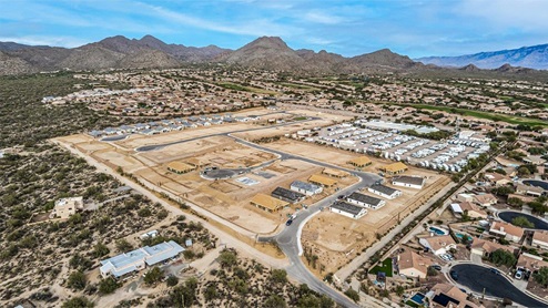 Welcome to Tortolita Trails, where new homes by D.R. Horton blend luxury and nature in the prestigious Dove Mountain area of Marana, Arizona. This exclusive community offers a serene living experience with only 82 homesites spread across 30 spacious acres, ensuring a low-density environment that provides ample privacy and tranquility. Surrounded by breathtaking 360-degree views of the Tortolita and Catalina Mountains, Tortolita Trails is a nature lover’s dream, with easy access to numerous trailheads, parks, and outdoor activities. Tortolita Trails features six charming single-story floor plans, ranging from 1,400 to 1,900 square feet, each crafted with high-quality finishes and modern amenities. Homes in this community feature spacious lots, beautiful Spanish lace stucco exteriors, tile roofs, and exquisitely landscaped front yards with auto drip irrigation. Inside, you’ll find luxurious quartz countertops in the kitchens and bathrooms, tile shower walls, 42” shaker-style cabinets, and stunning wood-look tile flooring throughout the main living areas. Each home is designed for comfort and convenience, with 9-foot ceilings, recessed lighting, and a Home is Connected® Smart Home package that includes a smart thermostat, video doorbell, keyless entry, a Wi-Fi-enabled garage door opener and more. These homes are not only stylish but also energy-efficient, meeting the stringent DOE Zero Energy Ready Home standards. Equipped with tankless water heaters, energy-efficient LED lighting, and advanced spray foam insulation, these homes are designed to reduce your environmental footprint while providing long-term savings on energy costs. Additionally, each home includes a single basin stainless steel kitchen sink with a water filtration system and a soft water loop for enhanced water quality. Living in Tortolita Trails means being part of a community that values both elegance and connection to nature. The community offers a range of amenities, including a park, playground, walking paths, ramadas, and grassy areas with picnic benches, perfect for family gatherings and outdoor activities. The prestigious Golf Club at Dove Mountain and the 5-star Ritz Carlton Resort are just minutes away, offering world-class golfing, dining, and spa experiences. Families will appreciate the top-rated Marana Unified School District, with the highly-rated Dove Mountain CSTEM K-8 School within walking distance. The community’s location also provides easy access to shopping, dining, and entertainment, with the nearby Houghton Town Center and Tangerine Sky Community Park offering everything you need just a short drive away. For outdoor enthusiasts, Tortolita Trails is surrounded by natural beauty and endless recreational opportunities. Explore the 29 miles of trails at Tortolita Mountain Park, or visit the nearby Tortolita Preserve, a 2,400-acre expanse of untouched desert perfect for hiking, biking, and wildlife viewing. The community’s proximity to Saguaro National Park and the Camino Loma Alta Bike Trail further enhances its appeal to those who love the outdoors. Come home to Tortolita Trails, where the fusion of elegant living and natural splendor creates an unparalleled lifestyle. Embrace the essence of Arizona living at its finest in this extraordinary community.
