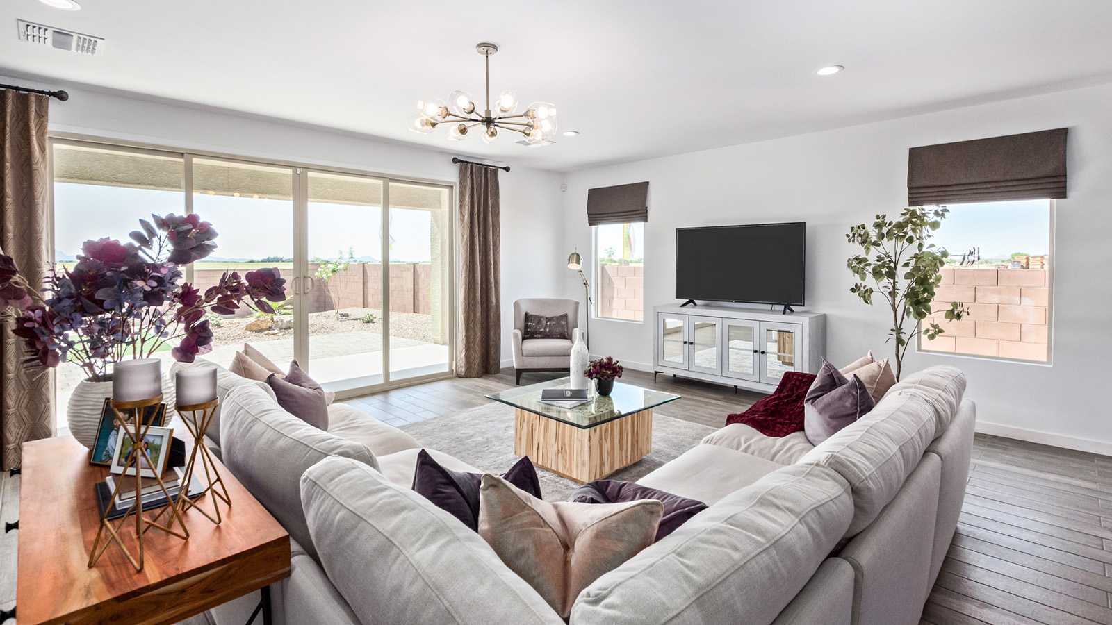 Introducing The Citrine, the crown jewel and largest floorplan within the Tortolita Trails community, located in the scenic Dove Mountain area of Marana, Arizona. Spanning 2,577 square feet, this impressive single-story new home offers a blend of space, style, and contemporary convenience, perfect for families seeking room to grow and entertain.  As you step through the welcoming entryway, you’re immediately drawn into the expansive great room, which flows comfortably into the dining area and kitchen. This open layout creates a warm and inviting atmosphere, ideal for both casual family dinners and larger gatherings. The kitchen is a chef's delight, complete with a spacious island, high-end quartz countertops, and ample storage within the 42” shaker-style cabinets. Adjacent to the kitchen, a cozy nook provides the perfect spot for morning coffee while enjoying views of the backyard.  The Citrine boasts five well-appointed bedrooms, providing flexibility for various lifestyle needs. The primary bedroom is situated at the rear of the home for added privacy, featuring a generous walk-in closet and a luxurious en-suite bathroom with dual sinks and a tiled shower. The additional four bedrooms are thoughtfully distributed throughout the home, offering comfort and convenience for guests or family members.  Outdoor living is a key feature of The Citrine, with a covered patio that extends the living space into the backyard, perfect for al fresco dining or simply relaxing in the shade. The two-car garage not only provides ample space for vehicles but also includes additional storage options to keep your home organized.  Energy efficiency and modern technology are at the forefront of The Citrine’s design. The home is equipped with tankless water heaters, energy-efficient LED lighting, and advanced spray foam insulation, all meeting the stringent DOE Zero Energy Ready Home standards. A Home is Connected® Smart Home package further enhances everyday living, with features like a smart thermostat, video doorbell, keyless entry, a Wi-Fi-enabled garage door opener and more.   As the largest floorplan within Tortolita Trails, The Citrine stands out not only for its size but also for its intentional layout and premium finishes. This home offers an unparalleled living experience in a community that embraces both elegance and a deep connection to nature. With easy access to outdoor activities, top-rated schools, and upscale amenities, The Citrine provides the perfect blend of comfort, style, and convenience in one of Arizona's most desirable neighborhoods.