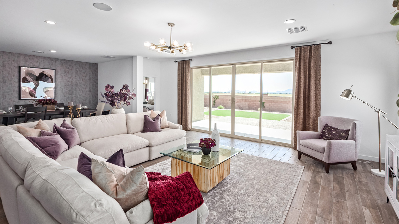 Introducing The Citrine, the crown jewel and largest floorplan within the Tortolita Trails community, located in the scenic Dove Mountain area of Marana, Arizona. Spanning 2,577 square feet, this impressive single-story new home offers a blend of space, style, and contemporary convenience, perfect for families seeking room to grow and entertain.  As you step through the welcoming entryway, you’re immediately drawn into the expansive great room, which flows comfortably into the dining area and kitchen. This open layout creates a warm and inviting atmosphere, ideal for both casual family dinners and larger gatherings. The kitchen is a chef's delight, complete with a spacious island, high-end quartz countertops, and ample storage within the 42” shaker-style cabinets. Adjacent to the kitchen, a cozy nook provides the perfect spot for morning coffee while enjoying views of the backyard.  The Citrine boasts five well-appointed bedrooms, providing flexibility for various lifestyle needs. The primary bedroom is situated at the rear of the home for added privacy, featuring a generous walk-in closet and a luxurious en-suite bathroom with dual sinks and a tiled shower. The additional four bedrooms are thoughtfully distributed throughout the home, offering comfort and convenience for guests or family members.  Outdoor living is a key feature of The Citrine, with a covered patio that extends the living space into the backyard, perfect for al fresco dining or simply relaxing in the shade. The two-car garage not only provides ample space for vehicles but also includes additional storage options to keep your home organized.  Energy efficiency and modern technology are at the forefront of The Citrine’s design. The home is equipped with tankless water heaters, energy-efficient LED lighting, and advanced spray foam insulation, all meeting the stringent DOE Zero Energy Ready Home standards. A Home is Connected® Smart Home package further enhances everyday living, with features like a smart thermostat, video doorbell, keyless entry, a Wi-Fi-enabled garage door opener and more.   As the largest floorplan within Tortolita Trails, The Citrine stands out not only for its size but also for its intentional layout and premium finishes. This home offers an unparalleled living experience in a community that embraces both elegance and a deep connection to nature. With easy access to outdoor activities, top-rated schools, and upscale amenities, The Citrine provides the perfect blend of comfort, style, and convenience in one of Arizona's most desirable neighborhoods.