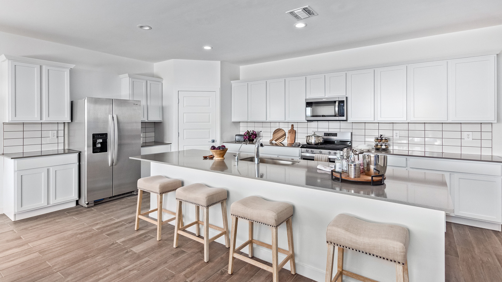 Introducing The Citrine, the crown jewel and largest floorplan within the Tortolita Trails community, located in the scenic Dove Mountain area of Marana, Arizona. Spanning 2,577 square feet, this impressive single-story new home offers a blend of space, style, and contemporary convenience, perfect for families seeking room to grow and entertain.  As you step through the welcoming entryway, you’re immediately drawn into the expansive great room, which flows comfortably into the dining area and kitchen. This open layout creates a warm and inviting atmosphere, ideal for both casual family dinners and larger gatherings. The kitchen is a chef's delight, complete with a spacious island, high-end quartz countertops, and ample storage within the 42” shaker-style cabinets. Adjacent to the kitchen, a cozy nook provides the perfect spot for morning coffee while enjoying views of the backyard.  The Citrine boasts five well-appointed bedrooms, providing flexibility for various lifestyle needs. The primary bedroom is situated at the rear of the home for added privacy, featuring a generous walk-in closet and a luxurious en-suite bathroom with dual sinks and a tiled shower. The additional four bedrooms are thoughtfully distributed throughout the home, offering comfort and convenience for guests or family members.  Outdoor living is a key feature of The Citrine, with a covered patio that extends the living space into the backyard, perfect for al fresco dining or simply relaxing in the shade. The two-car garage not only provides ample space for vehicles but also includes additional storage options to keep your home organized.  Energy efficiency and modern technology are at the forefront of The Citrine’s design. The home is equipped with tankless water heaters, energy-efficient LED lighting, and advanced spray foam insulation, all meeting the stringent DOE Zero Energy Ready Home standards. A Home is Connected® Smart Home package further enhances everyday living, with features like a smart thermostat, video doorbell, keyless entry, a Wi-Fi-enabled garage door opener and more.   As the largest floorplan within Tortolita Trails, The Citrine stands out not only for its size but also for its intentional layout and premium finishes. This home offers an unparalleled living experience in a community that embraces both elegance and a deep connection to nature. With easy access to outdoor activities, top-rated schools, and upscale amenities, The Citrine provides the perfect blend of comfort, style, and convenience in one of Arizona's most desirable neighborhoods.